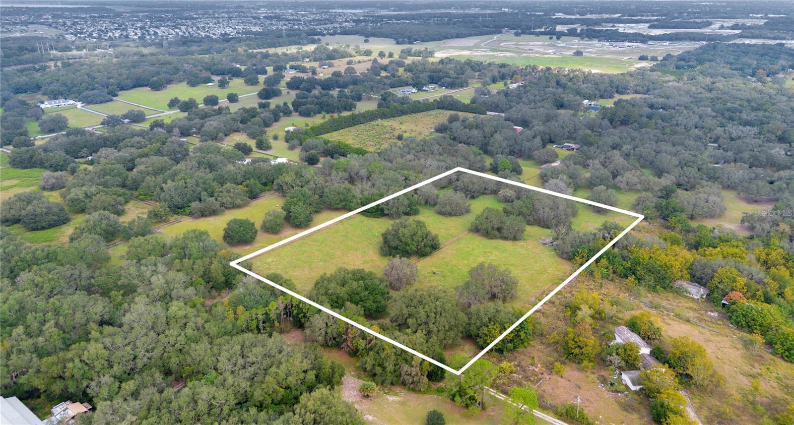 One or more photo(s) has been virtually staged. 10 Acres of Private Florida Living – Rolling Acre Rd, Fruitland Park, FL 34731
Escape to wide-open space and endless possibilities with this beautiful 10-acre parcel in the peaceful community of Fruitland Park. Perfectly suited for a private estate, equestrian property, or hobby farm, this land offers the ideal setting to build your dream home surrounded by nature, privacy, and tranquility while still being just minutes from The Villages, shopping, dining, and major roadways.

Zoned agricultural, this property allows for one primary residence plus an accessory dwelling unit (in-law suite), making it an excellent option for multi-generational living or a private guest retreat. With ample room for barns, gardens, animals, or outdoor living spaces, you can truly create a lifestyle tailored to your vision.

Enjoy the best of Central Florida living peaceful, spacious, and connected. Whether you’re looking to build now or invest in land for the future, this rare 10-acre opportunity offers flexibility, value, and long-term potential in a growing area.