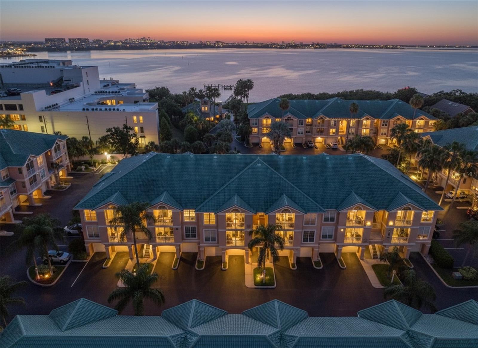 Welcome to Island Club at Rocky Point, a gated, waterfront community set along beautiful Old Tampa Bay! Filled with natural light and a refreshing coastal breeze feel, this third-story condo features an oversized garage with generous storage and an additional driveway providing parking for a second vehicle. Residents enjoy resort-style waterfront amenities including a heated saltwater pool, jacuzzi, sauna, outdoor showers, grilling area, fitness center, clubhouse, and a private community pier - perfect for launching your kayak, fishing, or simply taking in the peaceful bay views. Perfectly situated, this community is just a short walk to restaurants, bars, biking and walking paths, and only minutes to Tampa International Airport, International Mall, Raymond James Stadium, the sugary sand of Clearwater Beach, and major highways for easy commuting. The HOA fee includes premium internet and cable service, security gate, flood insurance, roof and exterior maintenance, pest control, car wash and vacuum area, grounds maintenance, property management, escrow reserves, and full access to the community's high-end amenities. Upgrades and improvements: Full kitchen remodel 2024, New washing machine 2026, New garbage disposal 2025, New LTV flooring and new floor board trim 2024, Full bathroom remodel 2025, New garage door opener including new keypad and hinges/wheels 2025, New keypad code front door 2025, New balcony screening 2024, Interior freshly painted 2025, AC serviced 2025. Schedule your private showing today and experience resort-style waterfront living at Island Club at Rocky Point.