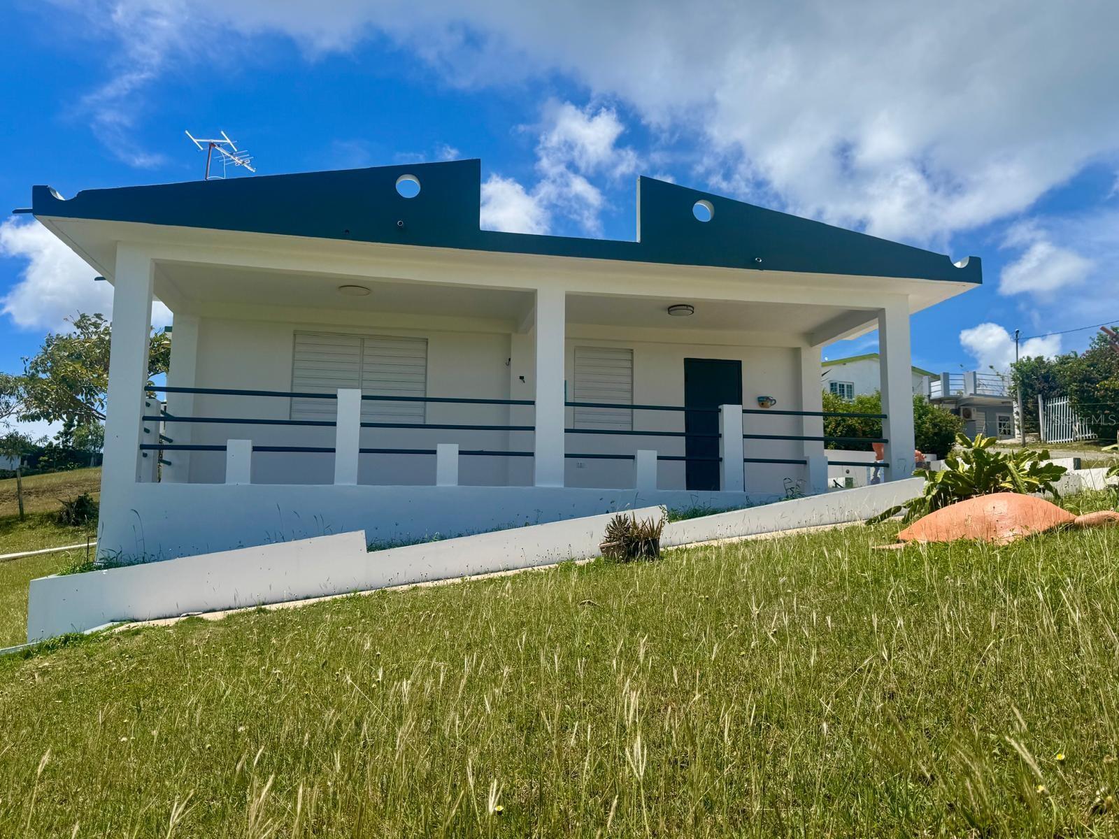 Discover the charm of island living with this well-maintained 2-bedroom, 1-bath home located in a quiet urban neighborhood of Vieques, Puerto Rico. Just a short walk from the beach, this property offers refreshing ocean breezes from its inviting balcony and beautiful views toward Culebra Island.

The home features an open living, dining, and kitchen area designed for comfortable everyday living or relaxing weekend getaways. Situated on a 4,710.76 sq. ft. lot with approximately 755 sq. ft. of living space, the property also includes a spacious backyard with a storage shed, providing additional space for equipment or beach gear.

Recent improvements include interior and exterior painting as well as a recently treated roof, offering added peace of mind. Built on a strong foundation, the home presents excellent potential for expansion, including the possibility of adding a second living unit above the existing structure, subject to buyer verification and applicable permits.

Owned by the same owner since construction, this property is ideal as a primary residence, vacation home, or an investment opportunity for short-term or long-term rental income. Located on Vieques—one of Puerto Rico's fastest-growing tourism destinations and home to some of the island's most spectacular beaches—this property offers an exceptional opportunity to enjoy the Caribbean lifestyle while benefiting from the island's continued growth.