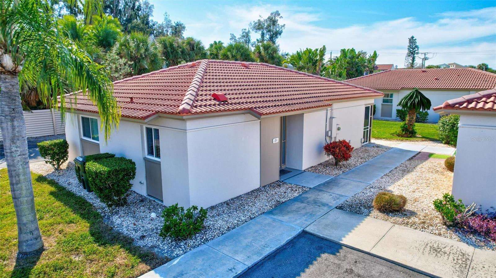 One or more photos have been virtually staged.   Welcome to your maintenance free, dream beach retreat on Siesta Key! This charming and meticulously remodeled 2-bedroom, 2-bath villa offers the perfect blend of luxury and convenience, just a short stroll from the pristine sands of Crescent Beach. Enjoy cooking in a stunning kitchen featuring brand new quartz countertops, stainless steel appliances, and stylish light fixtures.  Experience comfort year-round with newly installed HVAC and energy-efficient tankless water heater.  Luxury vinyl panel floors flows seamlessly throughout, offering both durability and aesthetic appeal.  Relax in the attached, screened-in lanai, complete with No-See-Um screen, aluminum framing and a new Hunter, wet-rated ceiling fan, perfect for warm island evenings.  Both bathrooms have been beautifully remodeled providing a fresh, contemporary feel.  Located just a few steps from the Clubhouse, heated pool, outside grilling areas and laundry facility.  Walking distance to shops, restaurants and entertainment.  Enjoy the easy, island lifestyle with access to the free trolley service to Siesta Key Village for even more shopping and dining experiences.  Ideal for a second home, rental investment, or full-time residence.  Don't miss this great opportunity to own a piece of paradise! Schedule your showing today and embrace the Siesta Key lifestyle!