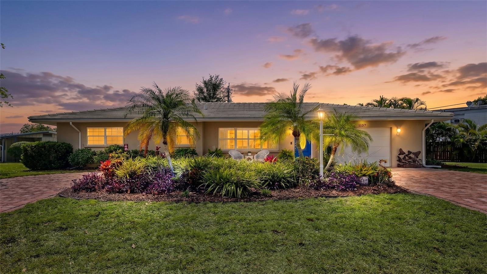 PRICE ADJUSTMENT of $25k. Private Oasis Awaits! This home is perfect for year round living, a Florida get away or an income generating property. It offers 3 bedrooms and 2 bathrooms and just under 2,000 square feet of comfortable living. The layout is thoughtfully designed, with 3 separate sitting areas with an abundant natural light through the large windows. The tiled flooring provides a clean, modern aesthetic, complemented by the neutral color palette. The updated kitchen is spacious, with ample wood cabinetry and a quartz countertop, providing plenty of storage and preparation space. The primary bedroom is generously sized with a bathroom, offering a comfortable retreat and a door to walk out onto covered lanai. Additional features include an inside laundry room, newer appliances, energy-efficient double-pane windows, tile roof only 10 years old and plantation shutters throughout for added charm. The outdoor space is perfect private oasis for relaxation while enjoying the sparkling resurfaced pool with a screened enclosure. The oversized lot features lush landscaping and spacious paved driveway, creating a welcoming outdoor atmosphere. In addition, the backyard is fenced in for pets with plenty of room to store watercraft. If desired, the property is Airbnb-ready and is within city limits so weekly rentals are approved. The city location makes for an ideal choice to call home to escape and relax on Siesta Key beaches or explore downtown Sarasota and all it has to offer.
