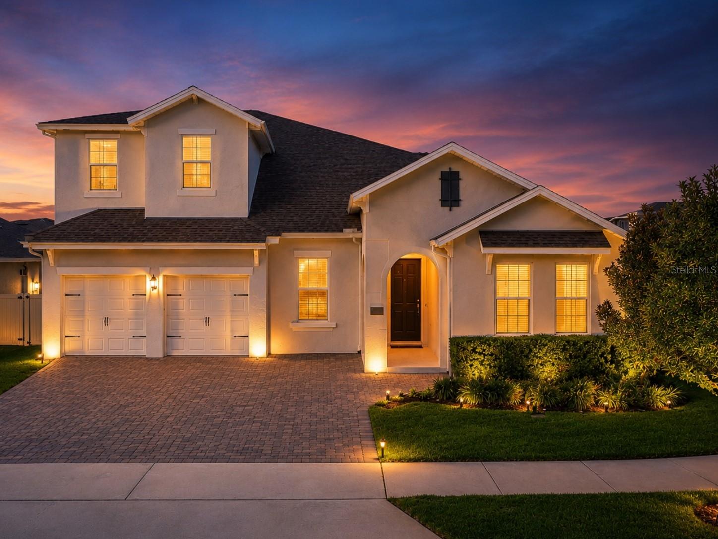Welcome to luxury living in the highly sought-after Lakeside at Hamlin community in Winter Garden, Florida. Built in 2022 and situated on a spacious corner lot, this beautifully upgraded home combines elegant design, modern technology, and exceptional outdoor living. This two-story home is just under 4,000 square feet of living space, features seven true bedrooms, four spacious bathrooms, ample closets, a two-car garage with a paver driveway, a fenced backyard, and a screened-in pool, with the oversized kitchen flowing seamlessly into the living room and dining room. Additional upgrades include: * Smart thermostats * Security system * Irrigation system * CAT 6 wiring * New blinds throughout * Custom closet systems * Stainless-steel kitchen appliances, washer and dryer * Natural-gas community * HOA includes fiber-optic cable * Fenced backyard * Screened pool enclosure and pool equipment. Step through the covered front porch and arched entryway into a bright and inviting interior featuring high ceilings, recessed lighting, crown molding, tall baseboards, built-in art niches, designer doors, and hardware. French doors and abundant natural light create a warm atmosphere throughout. The heart of the home is an impressive chef's kitchen complete with custom cabinetry, a large center island with a deep stainless sink, a solid surface cooktop, an upgraded vent hood, stainless steel appliances, a glass tile backsplash, a coffee station, and an oversized breakfast counter perfect for casual dining and entertaining. The luxurious primary suite offers a spa-inspired bath with dual vanities, solid-surface countertops, an oversized walk-in closet with custom organizers and a folding table, dual showerheads, and upgraded finishes throughout. Bedroom Two offers a full private ensuite bathroom downstairs, perfect for guests or family wanting extra privacy. Bedrooms Four and Five are currently used as private home offices. Upstairs, Bedroom Six is used as a home gym, and Bedroom Seven is used as a media room. Both bedrooms have large walk-in closets and share a spacious bathroom upstairs. Designed for Florida living, the backyard is truly exceptional. Enjoy your private screened custom pool featuring a sun shelf, all surrounded by a beautifully fenced yard with professional landscaping and irrigation. The expansive sealed paver patio is already plumbed for a future summer kitchen or wet bar, creating the ideal setting for outdoor entertaining. Built with attention to detail and thoughtfully enhanced inside and out, this move-in-ready residence offers the perfect blend of luxury, comfort, and convenience, just minutes from Hamlin Town Center, shopping, dining, and entertainment, with easy access to Disney, Downtown Winter Garden, and major highways.