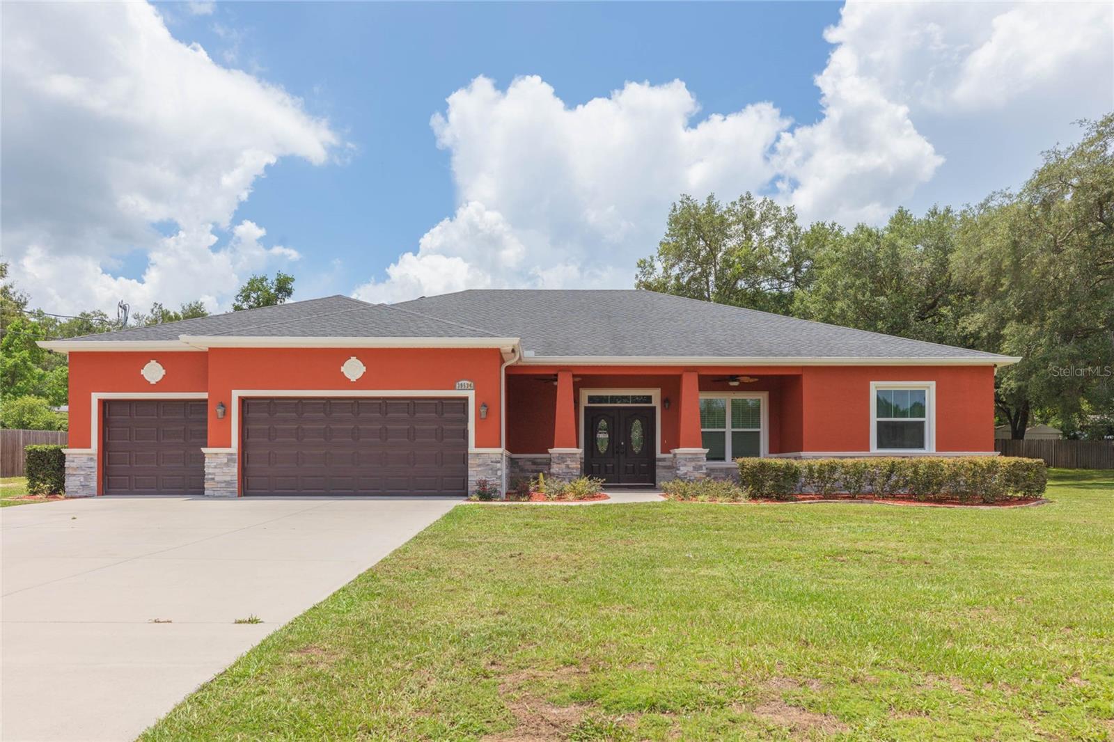 If you're shopping for a NEW CONSTRUCTION home do not buy from one of the national builders on a tiny lot until you explore all this custom built home has to offer! Situated on a spacious .52 acre lot with NO HOA OR CDD RULES OR FEES near the end of a dead end street offering a quiet, low traffic setting. Connected to high speed internet, public water with a fire hydrant across the street for fire protection and homeowner's insurance savings. ENERGY EFFICIENCY features include impact storm, insulated ENERGYSTAR WINDOWS, GAS TANKLESS WATER HEATER, GAS RANGE, and GAS DRYER. Open floor plan offers a spacious kitchen with breakfast bar, tile flooring throughout, high ceilings with crown molding, recessed LED lighting, and a great room living area. The cook's kitchen offers a pot filler faucet, 42" custom cabinetry topped with granite countertops, tile backsplash, stainless steel appliance suite, pantry, and breakfast bar island. The master bedroom ensuite offers dual closet plus a horizon window above the bed which provides natural lighting throughout the room. Master bath suite features a designer slipper tub, walk in tile shower with an oversized bench and euro style glass doors, shower spray wall, and a dual sink vanity. Conveniently located between Dade City, Zephyrhills, and Lakeland. RV and boat parking is permitted on the lot.
