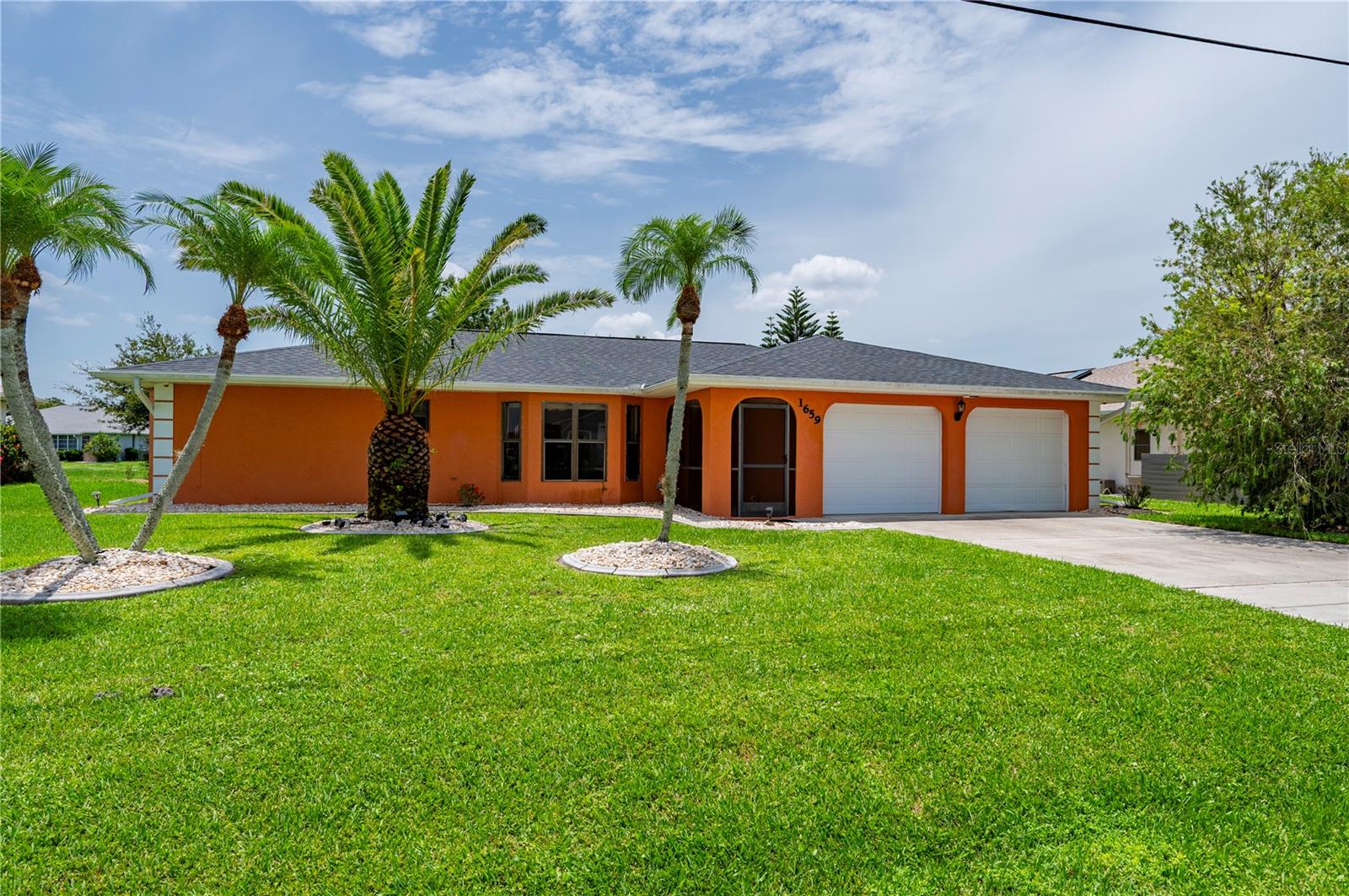 Investor opportunity in the deed-restricted community of Deep Creek! This 3-bedroom, 2-bath home offers 1,466 square feet of living space with a functional split-bedroom floor plan. Tile flooring runs throughout the living room, dining room, with tile also in the kitchen for easy maintenance. The primary suite features a large walk-in closet, and the primary bath provides direct access to the laundry room. Storm windows have been installed in the guest bedrooms, with only paint needed to complete the project. Guest bath has the refitted plastic shell shower install and a partial fluorescent lighting project completed. Relax on the spacious tiled lanai overlooking the backyard and greenbelt, providing added privacy and an open feel. The roof is approximately four years old. Conveniently located near Kings Highway with quick access to I-75, Punta Gorda Airport, downtown Punta Gorda, shopping, dining, golf, and Charlotte Harbor. With great bones and plenty of potential, this home is ready for its next owner.