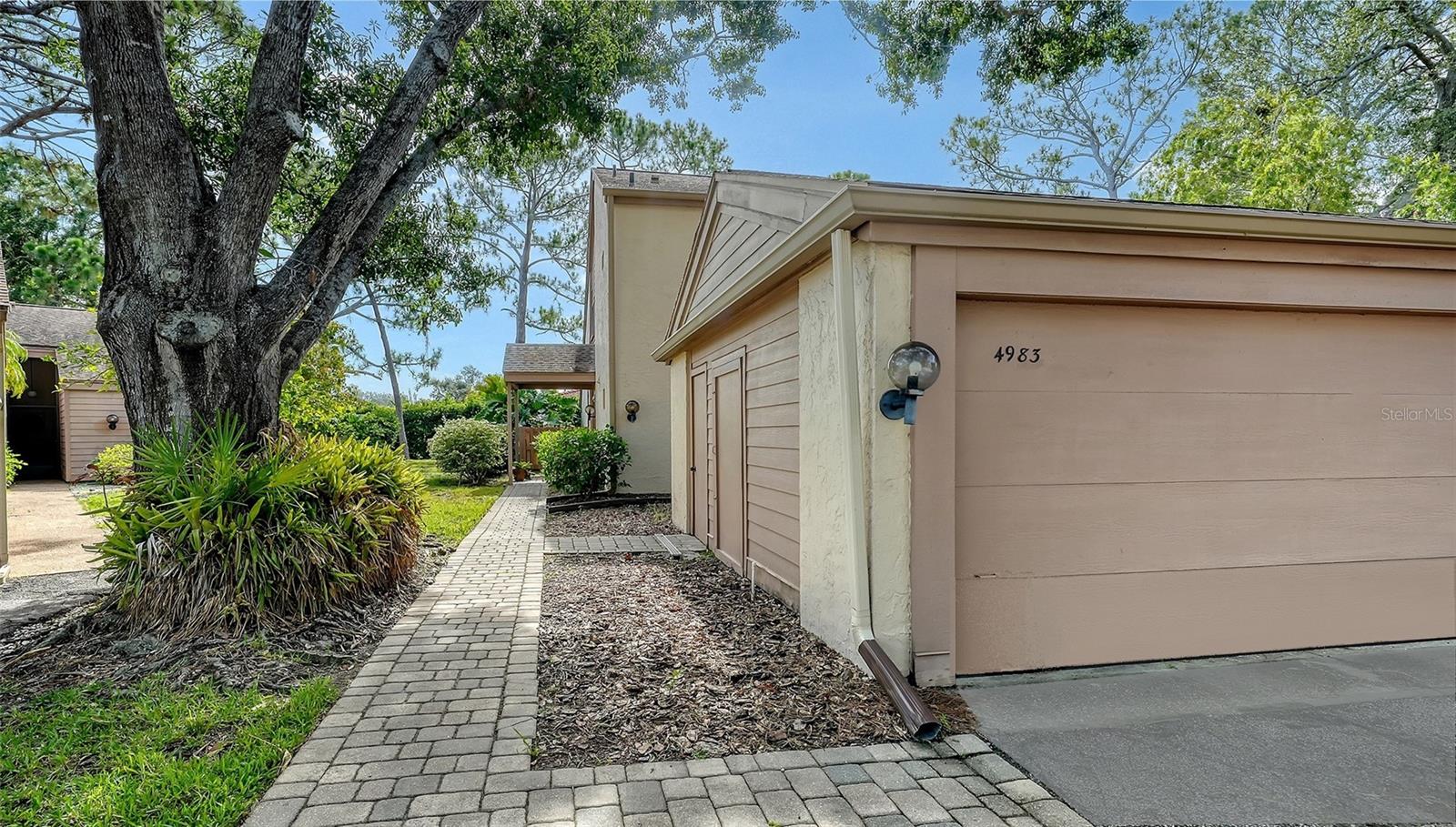 Centrally located townhouse, with main bedroom on first floor, in The Meadows, one of Sarasota’s sought-after neighborhoods just 15 minutes from downtown. A canopied street and a two-car garage welcome you home. Inside you’ll be greeted by a charming atrium that fills the space with gorgeous indirect light and cathedral ceilings in the living room providing an open and airy feeling. You will love relaxing in the 20-foot screened-in lanai overlooking a tranquil and lush garden. Upstairs, you will find soaring ceilings, abundant natural light, and the other two bedrooms and a bath. All across the street from the heated community pool and a mile to all the fun The Meadows has to offer. Set on 1,600 park-like acres, The Meadows is a resort-style community just 15 minutes from downtown. Enjoy 14 miles of scenic trails and, for a low fee, access to a fitness center, Junior Olympic pool, pickleball, golf, and Har-Tru tennis. You’ll be minutes to award-winning beaches, vibrant arts and culture, Whole Foods, Trader Joe’s, Nathan Benderson Park, Mote SEA Aquarium, the future Sarasota Orchestra, and University Town Center: a favorite shopping and dining destination. A fabulous Florida lifestyle awaits. With 2022 air conditoner, 2011 shingle roof (condominium's responsibility) and above flood plain in zone X
