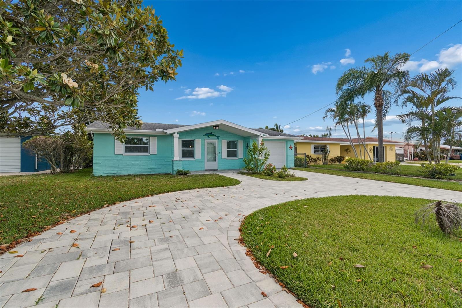 Welcome to this stunning canal-front home featuring breathtaking water views and quick access to the Gulf of Mexico. Located in the highly desirable Gulf Harbors community, this beautifully updated 3-bedroom, 2-bath, 1-car garage residence offers the perfect blend of comfort, style, and coastal living. Residents have the option to join the Gulf Harbors Civic Association for only $125 annually, which includes access to a private boat ramp and community activities. An additional optional membership of just $200 per year provides access to the exclusive private beach club, featuring beachfront cabanas, grills, swimming access, and spectacular sunset views from this hidden coastal gem.  
Completely renovated in 2024, this move-in-ready home showcases a brand-new kitchen with quartz countertops, a spacious island, ceramic tile flooring throughout, updated bathrooms, stylish ceiling fans, and attractive concrete pavers enhancing the front exterior. 
The open-concept floor plan offers formal living and dining areas filled with natural light, creating a warm and inviting atmosphere ideal for entertaining family and friends. Two guest bedrooms and a full bath are situated on one side of the home, while the private primary suite is tucked away toward the rear of the property. Step outside to the expansive fenced backyard and enjoy boating, fishing, and crabbing right from your own waterfront retreat. Additional updates include a newer A/C (2017) and roof (2013).  Conveniently located near shopping, dining, beaches, and entertainment, this property has no HOA or CDD fees—just relaxed Florida waterfront living at its finest.  Schedule your private showing today and experience the water-view lifestyle you’ve been dreaming of!