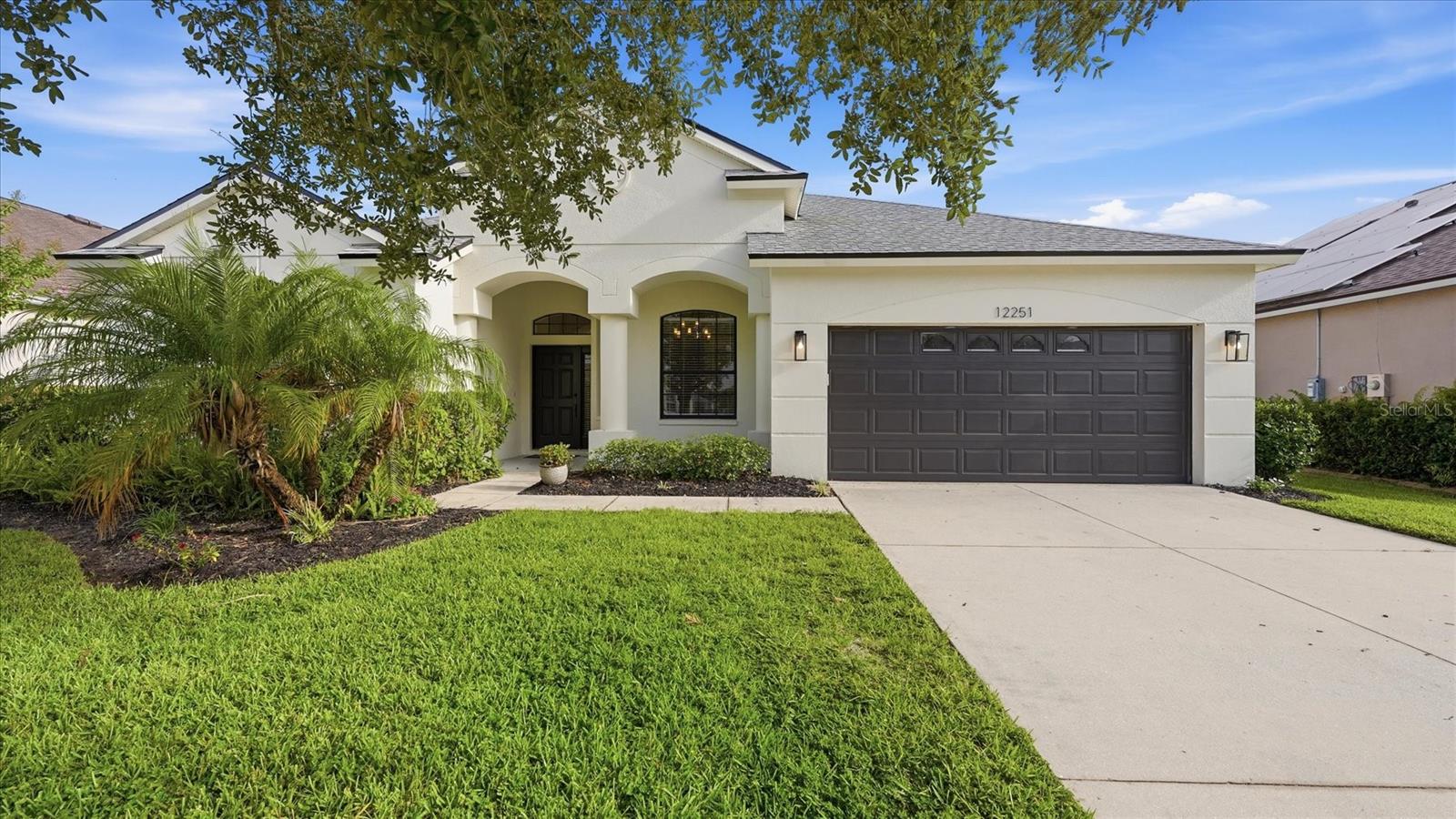 Virtually Staged. Welcome home to this beautifully maintained 4-bedroom, 2-bath residence in the sought-after River Plantation community of Parrish. From the moment you arrive, the inviting front porch creates the perfect setting to enjoy your morning coffee, greet neighbors, or simply unwind and enjoy Florida's year-round sunshine. Inside, you'll discover a bright and spacious split-bedroom floor plan designed for both comfortable everyday living and effortless entertaining. The heart of the home is the open-concept kitchen featuring granite countertops, stainless steel appliances, abundant cabinetry, a breakfast area, and seamless views into the family room, allowing everyone to stay connected. Ceramic tile flooring flows throughout the main living areas, while the additional bedrooms offer newer carpeting. The private primary suite provides a relaxing retreat with luxury vinyl plank flooring, dual walk-in closets, and an en-suite bath complete with dual sinks, a garden tub, and a separate shower. Three additional bedrooms offer flexibility for family, guests, a home office, or hobby space. Step outside to your spacious, fully fenced backyard where there's plenty of room for pets, play, gardening, or future outdoor living enhancements. Whether hosting weekend barbecues or enjoying a quiet evening under the stars, this backyard offers the privacy and space you've been looking for with a Conservation view. River Plantation is loved for its natural beauty, friendly atmosphere, affordable HOA, and NO CDD fees. Residents enjoy an impressive collection of amenities including a clubhouse, resort-style pool, and tennis courts, basketball courts, playgrounds, walking and nature trails, picnic areas, and a kayak/canoe launch with access to the Manatee River. Scenic lakes, ponds, and preserve views throughout the community create a true Florida lifestyle experience. Conveniently located near shopping, dining, schools, and major commuter routes, this home offers the perfect combination of comfort, recreation, and value. Don't miss your opportunity to experience all that River Plantation has to offer! Schedule your private showing today!