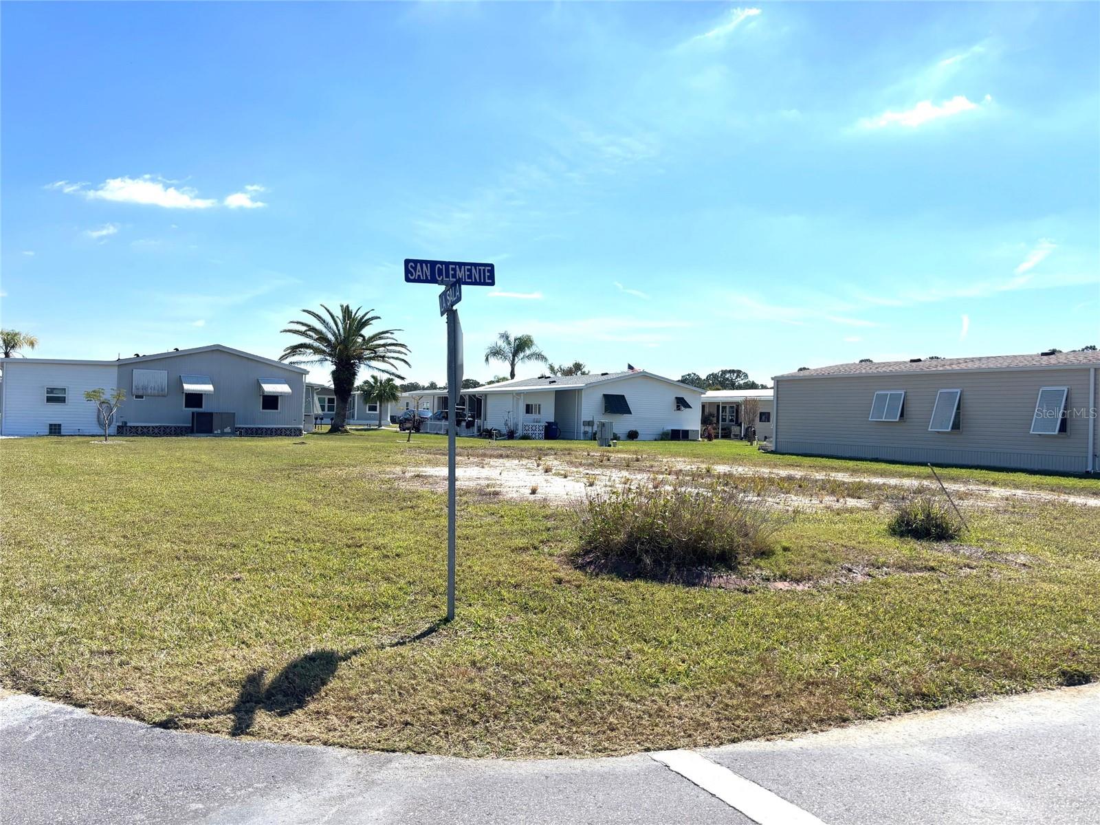 Vacant lot in a vibrant 55+ community!  La Casa offers the ultimate Florida lifestyle.  We have 974 homes nestled among a variety of native trees with spacious common grounds surrounding our eight lakes.  Located between Sarasota and Fort Myers, this is a boater's dream with access to the Gulf of Mexico. It is convenient for shopping, sightseeing, golfing, fishing, and boating, as well as all the culture and elegance the Southwest Florida area is noted for. La Casa may have the best pools in the area. Our crown jewel is an extremely large, 40 X 60-foot swimming pool that is kept at a perfect 87 degrees. Our smaller 20 x 40 pool is quietly nestled between the clubhouse and the Activity Building. Both pools have adjacent hot tubs which are ideal for soaking muscles that are tired from golfing or tennis. Wireless Internet (Wi-Fi) is available at the Clubhouse, Activity Building, and Recreation Hall area where these pools & spas are located, so you can catch some rays while you catch up on your email! Sound enticing? Come for a visit to this self-contained oasis and see for yourself why La Casa is the ultimate destination for both snowbirds and year-round residents!