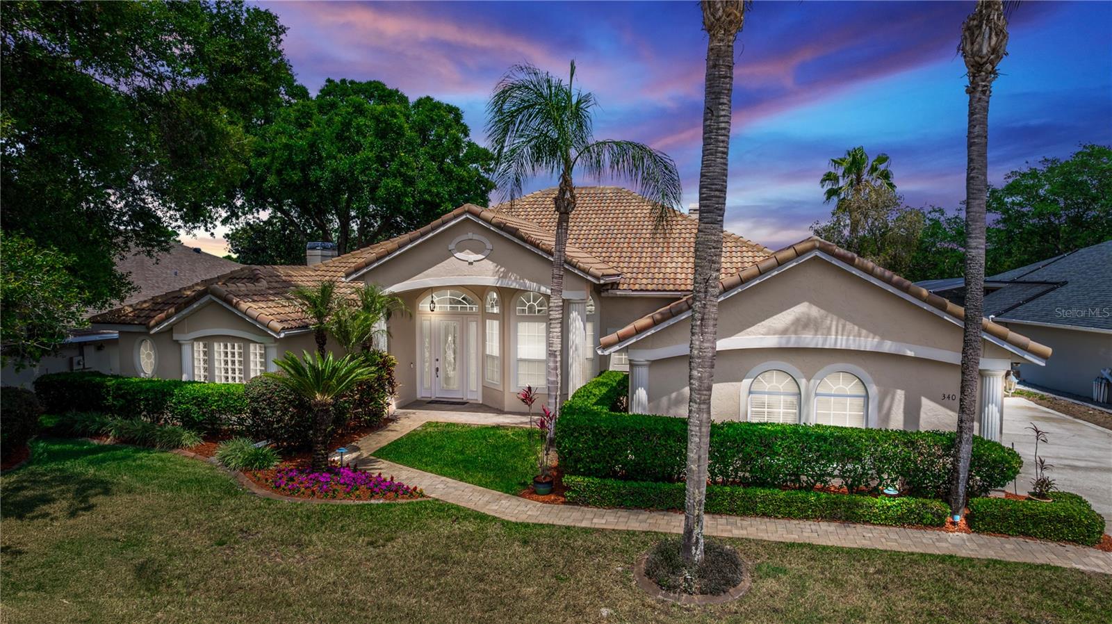 PRICE IMPROVEMENT! STOP SCROLLING—this is the golf-front pool home you’ve been waiting for in prestigious DeBary Country Club! NOW OFFERED AT $575,000 with up to $5,000 toward buyer closing costs or rate buy-down with an acceptable offer, plus up to 3% toward closing costs when using the seller’s preferred lender, Jeff Bilups with Century Financial. If you’ve been watching DeBary Country Club for the right home… this is it! And it will not last! Welcome to 340 Hampton Hills Court, a rare opportunity to own a golf-front pool home on the 10th hole of DeBary Country Club—where luxury, lifestyle, and location come together perfectly. This home delivers immediate impact from the moment you arrive, with a barrel tile roof and professional outdoor lighting creating standout curb appeal day and night. Inside, you’ll find a highly desirable split floor plan, brand-new luxury vinyl flooring, crown molding, and bright, open spaces filled with natural light. The oversized primary suite is a true retreat, featuring a custom cedar library, large walk-in closets, and a spacious en-suite bath with whirlpool tub and separate shower. The kitchen is built to impress with granite countertops, abundant cabinetry, and a wine refrigerator, opening directly into a cozy family room with a fireplace—perfect for everyday living or hosting guests. Need space? You’ve got it. A stunning solarium offers the perfect flex space for a gym, office, or quiet escape. The expansive bonus area is ideal for entertaining, complete with a mini fridge and ice machine—plenty of room for a pool table, game nights, or hosting unforgettable gatherings. Step outside to your private screened-in backyard oasis—featuring a sparkling pool, attached spa, and a dramatic tiered waterfall, all overlooking peaceful golf course views. This is the kind of backyard people dream about. Additional features include golf cart parking, mature landscaping, and full access to DeBary Country Club amenities—golf, tennis, fitness, dining, and more. Homes like this don’t sit—especially in this location. If you’ve been waiting for the right one, this is it. Schedule your showing before someone else beats you to it. All measurements are approximate and should be independently verified by the buyer.