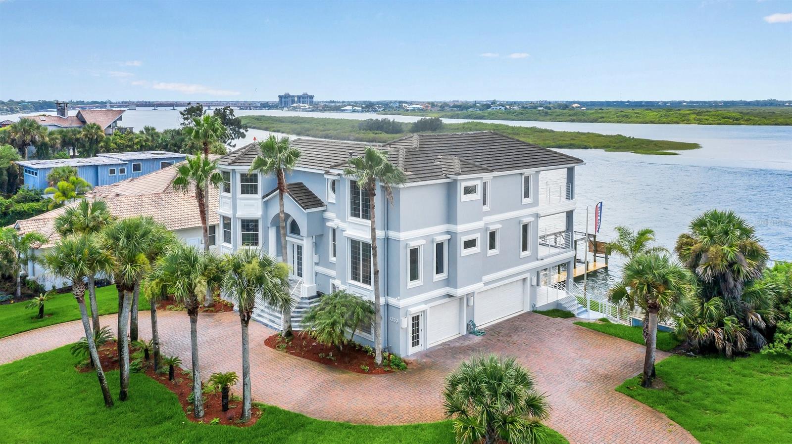 Come and see this gorgeous Intracoastal Riverfront Luxury home with views from the many back decks and balconies of sunsets over the Intracoastal Waterway. Completely renovated and modernized  three story home in New Smyrna Beach island on Florida's central east coast. 

This home has 5 bedrooms,  5 bathrooms. Master Bedroom has a private balcony with waterview, walking closet, amazing master bathroom with luxurious shower and bathtub. In the second floor an open-concept kitchen, dining and living room area with waterview. In addition to impressive architectural detail, it provides a spectacular vantage point and is accessible by stairs or by a 3 stop elevator. 

This home is in deep water , 9-10 ft depth at low tide. The location is perfect, with easy access via deep water motor yachting to Ponce Inlet and the Atlantic Ocean. The beach is just a short walk from your front door. It is just a few minutes walk to Historic Flagler Avenue shops and restaurants. Relax in a leisurely waterfront lifestyle. ;Water: City