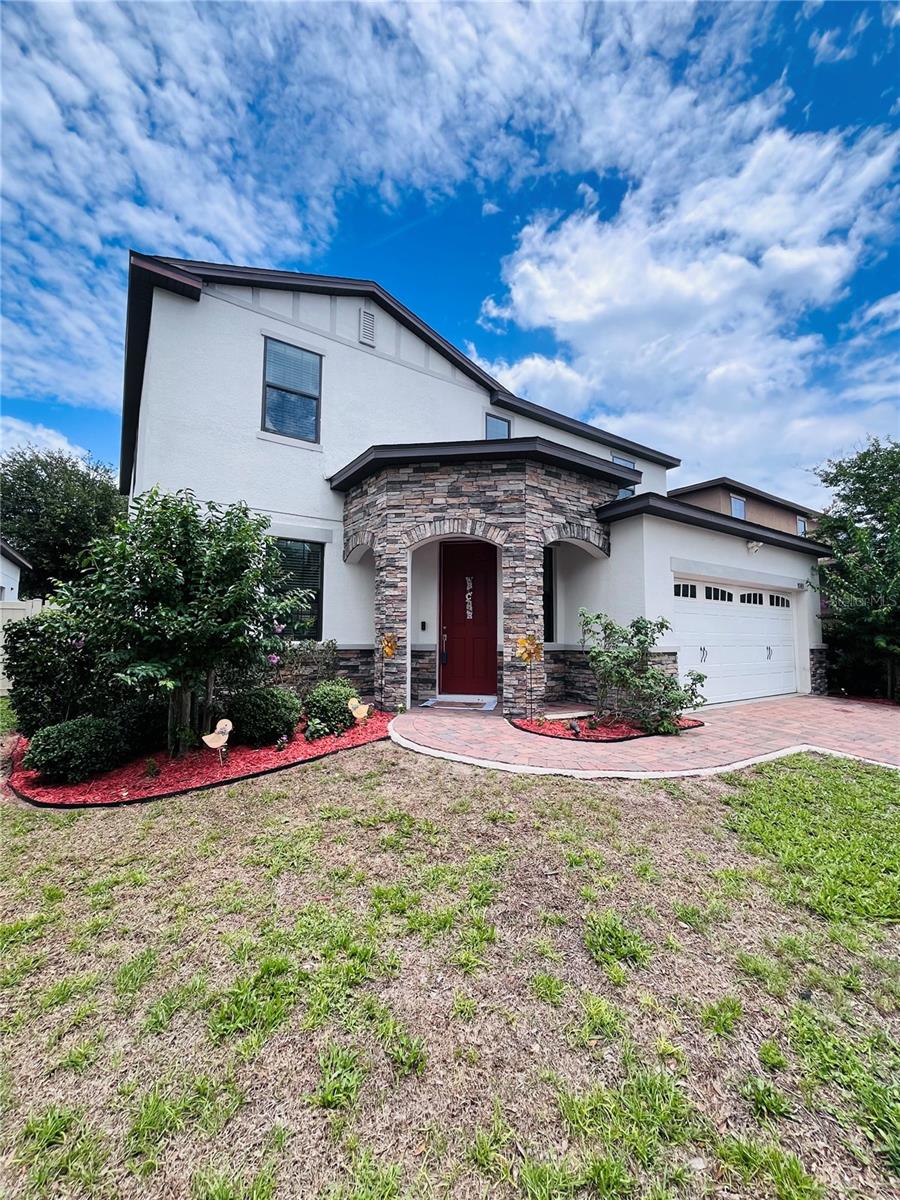 Welcome to this beautifully appointed 2 story 4-bedroom, 3.5-bath residence located in the desirable Cypress Oaks community in Groveland. Built in 2018, this thoughtfully designed home offers a covered stone entry way, 2 car garage, Tesla charging station, decorative pavers, open floor plan with the 1458 square feet of ceramic tile on the first floor, wide entry way, spacious formal living room, decorative trim double pane large windows, ½ bath, beautiful family room, floor to ceiling stone accent wall, built in electric fireplace for those cold days in Florida. The kitchen-dining is grand with a gourmet island, Formica countertops, and well-equipped SS appliances, deep sink, reverse osmosis, pantry, 3 pendant lighting, plenty of cabinet storage, dining area has 4 large windows with blinds included letting in the natural light giving it an open warm feel. Built-in desks with many usable options such as electronic charging stations, coffee station, homework station. The double sliding glass doors lead out to the covered lanai, fenced back yard for privacy. The laundry room is located on the first floor, along with a spacious mudroom as you walk in from garage. This is nice for backpacks, shoes and more.
As you walk upstairs, you’ll notice the decorative metal handrails and how wide the stairs are, giving you space to move freely, Under stair storage. The second-floor area is 1680 square feet with Luxury Vinyl flooring throughout “no carpet” you immediately notice the spacious loft/Great room with many usable options like a game room, playroom, 2nd family TV room. The primary bedroom is spacious with its own ensuite, walk in closet, dual counter tops, separate bedroom with its own ensuite, the other 2 bedrooms share a Jack-Jill bathroom, you also have an option to use one of the bedrooms as an Office 
There is a community pool which makes it nice to take a stroll then a dip and it’s just minutes away.  The community mailboxes are located a few doors down, there is a conservation area near, light post throughout the streets, sidewalks, nearby fire hydrant, a bike path on Jack Underwood Road that runs a few miles either side along CR 565A, a City Park & Recreation Ronald Sefton Gaffney Memorial Park inside the community just minutes driving on Maravilla Way that features a dog park, picnic benches parking, sidewalks, plenty of open spaces with mature trees covering the sun so you can enjoy the outdoors. This home has so much to offer if you just decide to stay within your community and low manageable HOA fees. Plus, you are 5 minutes away from downtown Clermont, shopping, groceries, banking, dining, major roadways and much more.