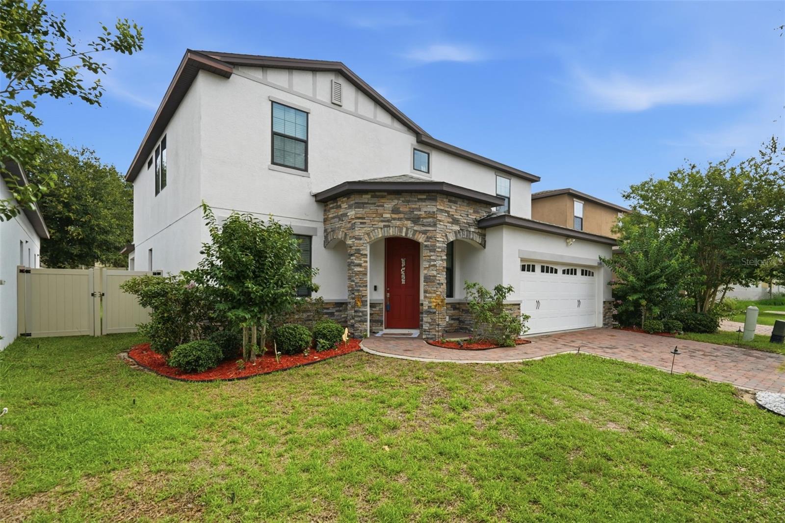 Welcome to this beautifully appointed 2 story 4-bedroom, 3.5-bath residence located in the desirable Cypress Oaks community in Groveland. Built in 2018, this thoughtfully designed home offers a covered stone entry way, 2 car garage, Tesla charging station, decorative pavers, open floor plan with the 1458 square feet of ceramic tile on the first floor, wide entry way, spacious formal living room, decorative trim double pane large windows, ½ bath, beautiful family room, floor to ceiling stone accent wall, built in electric fireplace for those cold days in Florida. The kitchen-dining is grand with a gourmet island, Formica countertops, and well-equipped SS appliances, deep sink, reverse osmosis, pantry, 3 pendant lighting, plenty of cabinet storage, dining area has 4 large windows with blinds included letting in the natural light giving it an open warm feel. Built-in desks with many usable options such as electronic charging stations, coffee station, homework station. The double sliding glass doors lead out to the covered lanai, fenced back yard for privacy. The laundry room is located on the first floor, along with a spacious mudroom as you walk in from garage. This is nice for backpacks, shoes and more.
As you walk upstairs, you’ll notice the decorative metal handrails and how wide the stairs are, giving you space to move freely, Under stair storage. The second-floor area is 1680 square feet with Luxury Vinyl flooring throughout “no carpet” you immediately notice the spacious loft/Great room with many usable options like a game room, playroom, 2nd family TV room. The primary bedroom is spacious with its own ensuite, walk in closet, dual counter tops, spacious 2nd bedroom next to full bathroom, the other 2 bedrooms share a Jack-Jill bathroom, you also have an option to use one of the bedrooms as an Office 
There is a community pool which makes it nice to take a stroll then a dip and it’s just minutes away.  The community mailboxes are located a few doors down, there is a conservation area near, light post throughout the streets, sidewalks, nearby fire hydrant, a bike path on Jack Underwood Road that runs a few miles either side along CR 565A, a City Park & Recreation Ronald Sefton Gaffney Memorial Park inside the community just minutes driving on Maravilla Way that features a dog park, picnic benches parking, sidewalks, plenty of open spaces with mature trees covering the sun so you can enjoy the outdoors. This home has so much to offer if you just decide to stay within your community and low manageable HOA fees. Plus, you are 5 minutes away from downtown Clermont, shopping, groceries, banking, dining, major roadways and much more.