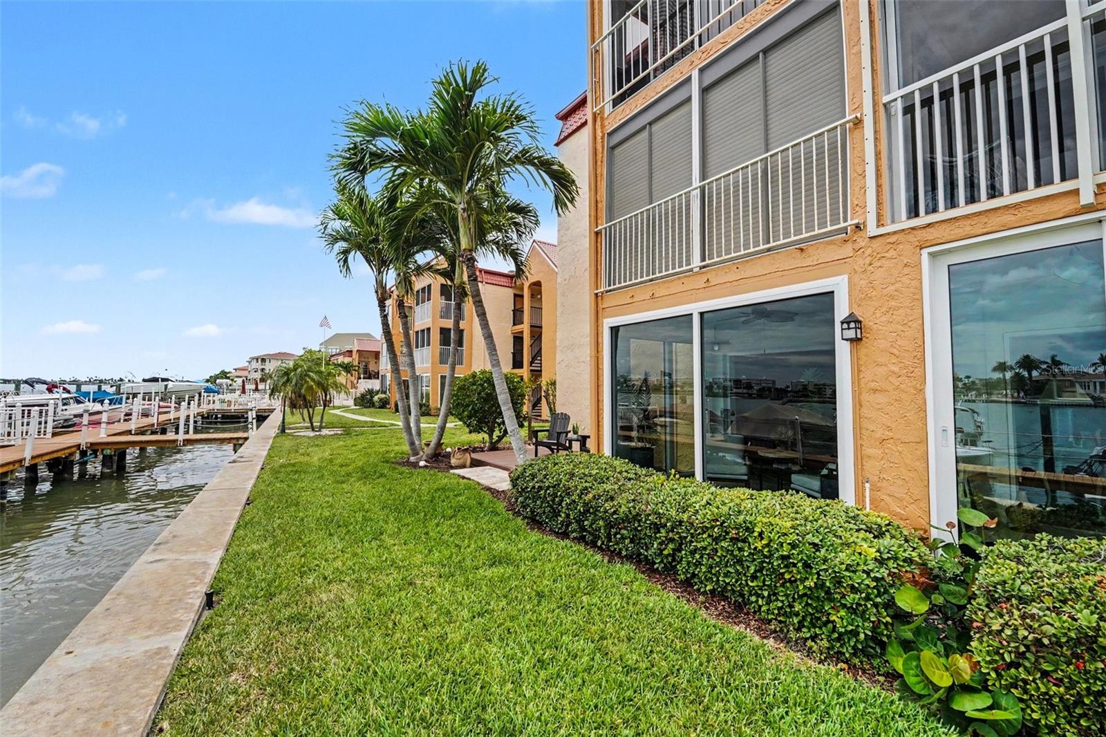 Welcome to this rare and highly coveted first-floor CORNER END UNIT tucked inside the gated waterfront community of Boca Shores. As the ONLY unit currently available featuring a direct, unobstructed waterfront view, this premium single-story sanctuary boasts brand-new premium impact-rated hurricane windows and sliding glass doors, extensive modern upgrades throughout the entire first-floor layout, and the ultimate, rare everyday convenience of its own dedicated IN-UNIT WASHER AND DRYER HOOKUPS! Step inside and feel instantly at home—this property has been professionally staged to highlight its maximum potential, and all beautiful furnishings are available for purchase with the unit, making this a truly turn-key, move-in-ready opportunity! Extensively renovated from top to bottom, this 2-bedroom, 1-bathroom gem sits directly on the Intracoastal Waterway and is located just steps from the world-famous white sands of St. Pete Beach. Offering total peace of mind and an updated front exterior presence, the home features a tankless water heater, pristine tile flooring, and a sleek modern kitchen with quartz countertops and stainless steel appliances. Location is everything here—leave your car keys behind because you are within walking distance to a vibrant coastal lifestyle, including local dining favorites like Shrimpy’s Waterfront, The Helm, and Rick's Reef, as well as the eclectic shops and Sunday markets on Corey Avenue. You are also just minutes away from the historic charm of Pass-a-Grille, John's Pass, Sunset Beach, and Treasure Island. Ideal for seasonal snowbirds seeking a secure "lock-and-leave" winter retreat or savvy rental investors chasing strong returns, the association features a highly flexible rental policy to easily maximize your ROI during peak seasonal months. Deepening the value, the comprehensive condo fee includes high-speed internet, cable TV, water, sewer, and trash, making management completely effortless. Boaters will rejoice with on-site boat slips available for lease at an unbelievable $91/month (including water and electric), alongside kayak and bike storage. Directly adjacent to the community, you'll find Sunset Vista Park with active tennis and pickleball courts, plus a public boat ramp. Cash discount for a quick close, this beachside gem offers unmatched lifestyle perks and instant equity potential. Bring your offer today—with the option to buy it fully furnished—before this prime piece of Florida paradise is gone!