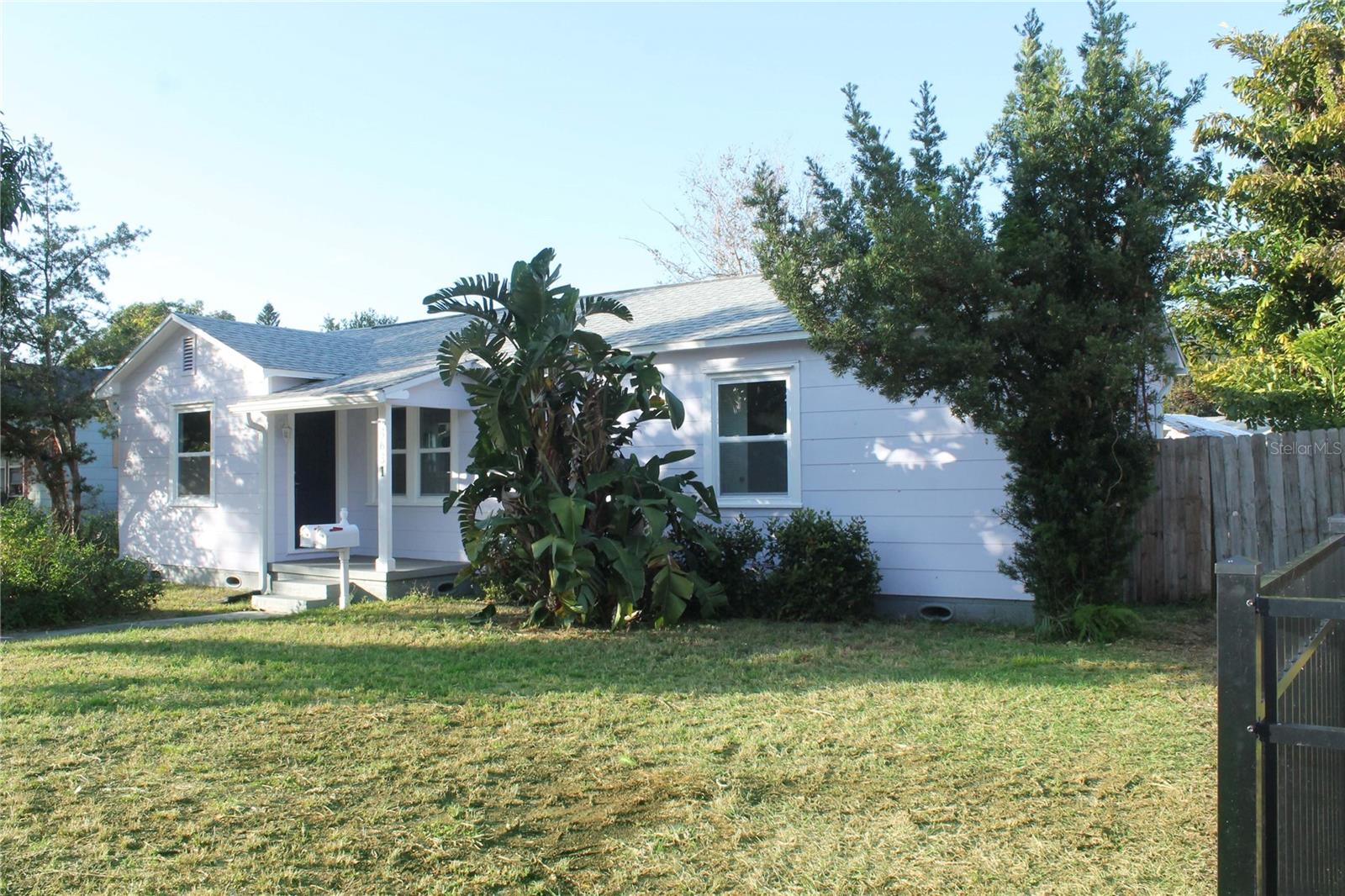 INCOME PROPERTY. THIS PROPERTY HAS A FULLY PERMITTED SEPARATE ADU. THIS IS NOT A FLIP! THIS HOME WAS IMPECCABLY REMODELED, AND CONTAINS A FULLY-PERMITTED ADU BUILT IN 2021. New roof installed as well in 2021, hurricane impact windows, aluminum gutters, and deck; new central A/C in 2024, new insulation in attic and a skylight in kitchen for added illumination, large lot over 8500 sq feet. Tented for termites 2024 (in garage). Units have separate electrical meters, main house and cottage share water meter with meter service to ADU. HIGH AND DRY! Discover the income potential with this property! Two separate units on a large lot. This property is located within minutes of downtown and the beaches. Perfect for investors seeking rental income or buyers interested in occupying the main home while generating income from the ADU (or vice versa), this property provides a world of possibilities in St. Pete. Beautifully renovated 2 bedroom 2 bath 1941 home with small office area/bonus room. This property includes a detached 1 bedroom 1 bath fully permitted Accessory Dwelling Unit built in 2021. The main home is situated at the front of the property facing brick lined streets on 4th Ave North . The main home features beautifully restored original oak floors, new tile in office and kitchen, granite countertops, new stove, refrigerator, dishwasher, garbage disposal, range, microwave, both baths renovated, large yard with mango tree separated by fence from ADU. ADU was built to category 4 Hurricane code in 2021 and is 600 square feet. Efficient floor plan that includes a full bath and a spacious utility room that includes a stacked washer/dryer and some storage. Tile throughout, granite countertops, central a/c. Cottage was designed with front entrance facing the rear alley access to provide total privacy from the front home. Designated parking space adjacent to the cottage makes this a perfect extended family property or an investment opportunity. Parking pad for front house. Room sizes to be verified by buyer.