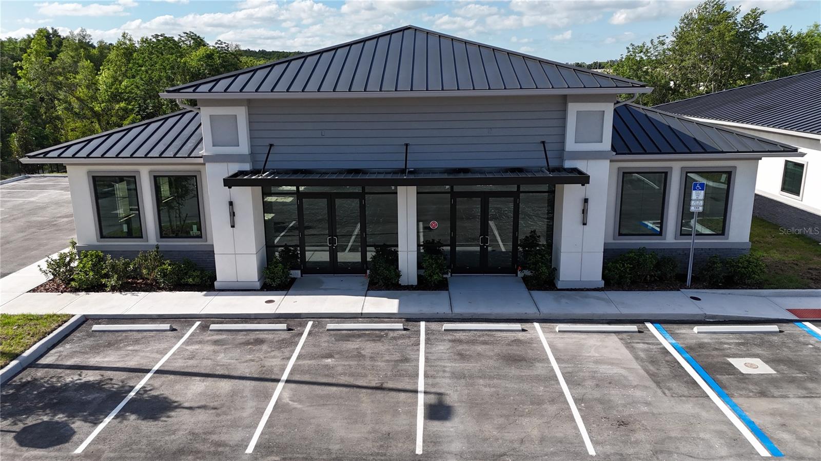 Building #10 is available for purchase at Lake Carter Exchange, a distinguished mixed-use development in Apopka’s East Shore at the intersection of Ocoee-Apopka Road and W Keene Road. This dark gray shell building is ideal for medical or professional offices, with potential for retail use based on buyer needs. The shell delivery offers full flexibility for custom interior design with two front entrances supporting up to two unique suites. The development is strategically located less than one mile from Advent Health’s seven-story, 120-bed hospital and opposite a new Publix Supermarket development. Situated in the vibrant East Shore trade area, which includes 5,000 planned residences and an average household income above $100k, this Class A property is perfectly positioned for businesses targeting growth in Central Florida’s second-fastest-growing city. Contact us for pricing details/incentives and to schedule a tour of this exceptional commercial opportunity.