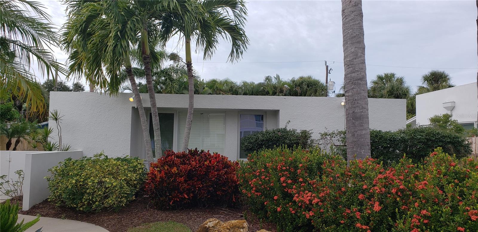 Siesta Key Sarasota Modern School of Architecture 1949 Beach House Bungalow with 35 X 9 lap pool.  Just a few steps from the world renown Siesta Key Beach with its glistening white quartz sand beach.  Walk to all the super restaurants, bars and shops of the Siesta Key Village.
