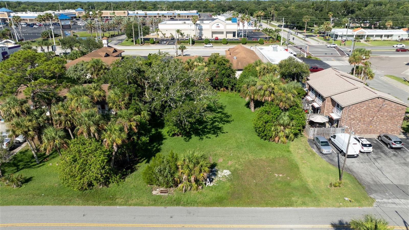 INVEST, DREAM AND BUILD. VACANT COMMERCIAL LAND located on S Palmetto Avenue in South Daytona, east of US1, boasts captivation views of the Halifax River. This .32 acre lot is ZONED COMMERCIAL VACANT LAND. Multi-use and within an opportunity zone, presenting a lucrative investment prospect. The lot is ready for development, with way access to amenities such as the boat ramp and picnic area just down the street. Additionally, the location is conveniently located across from the Sunshine Park Mall, making it a prime spot for a variety of commercial ventures.