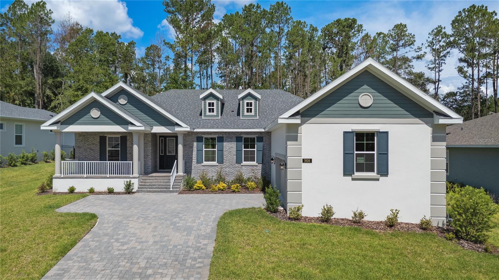 Virtually Staged. This stunning home built by semi-custom builder Spire Homes abounds with beautiful interior appointments and is located on one of the largest homesites within the community! This amazing home is beautifully positioned within the premier golf course and lifestyle community of Southern Hills Plantation. The lovely front exterior entry creates a warm and welcoming ambiance. Starting at the entry foyer, you will walk into a fabulous open, airy and spacious floor plan. This home features a gourmet, chef's delight kitchen with a massive island opening to the great room, allowing for ease of conversation and entertaining. The wood soft-close cabinetry throughout this beautiful home includes high-end quartz countertops, subway tile backsplash, and under-mount lighting with dimmers. You'll also love the 5-burner gas cooktop, gas tankless water heater and pre-plumbing, giving you the choice of gas or electric dryer. A 13 foot long walk-through pantry and an en-suite guest bed/bath offer fabulous uniqueness to this home. You will love the 8-foot doors and 5 1/4" baseboards throughout. The owner's suite and bath are awe-inspiring. LVP flooring in all main living areas comes with a lifetime residential warranty for further peace of mind. The expansive 35' extended lanai offers Florida outdoor living at its best. The lanai also offers a pre-plumbed gas drop for the further enjoyment of outdoor living and entertainment. The oversized side-entry garage allows for significant extra storage and sets the tone for the home's exterior ambiance. The homesite is oversized, measuring more than 260' deep, providing a very private backyard with a view of mature trees. Southern Hills Plantation offers a premier, manned and gated entrance and showcases a Pete Dye 18-hole Signature Golf Course. The elegant Southern Hills Clubhouse overlooks stunning rolling topography and the golf course. You'll love the Har-Tru clay surface tennis courts, pickleball courts, a full-service fitness center, swimming pool and spa, formal and informal restaurants, a putting green and driving range! If you are looking for a fabulous new home in a premier community, this home is for you! All information in this listing is intended to be accurate and is not warranted. The buyer or buyer's agent should verify all information.