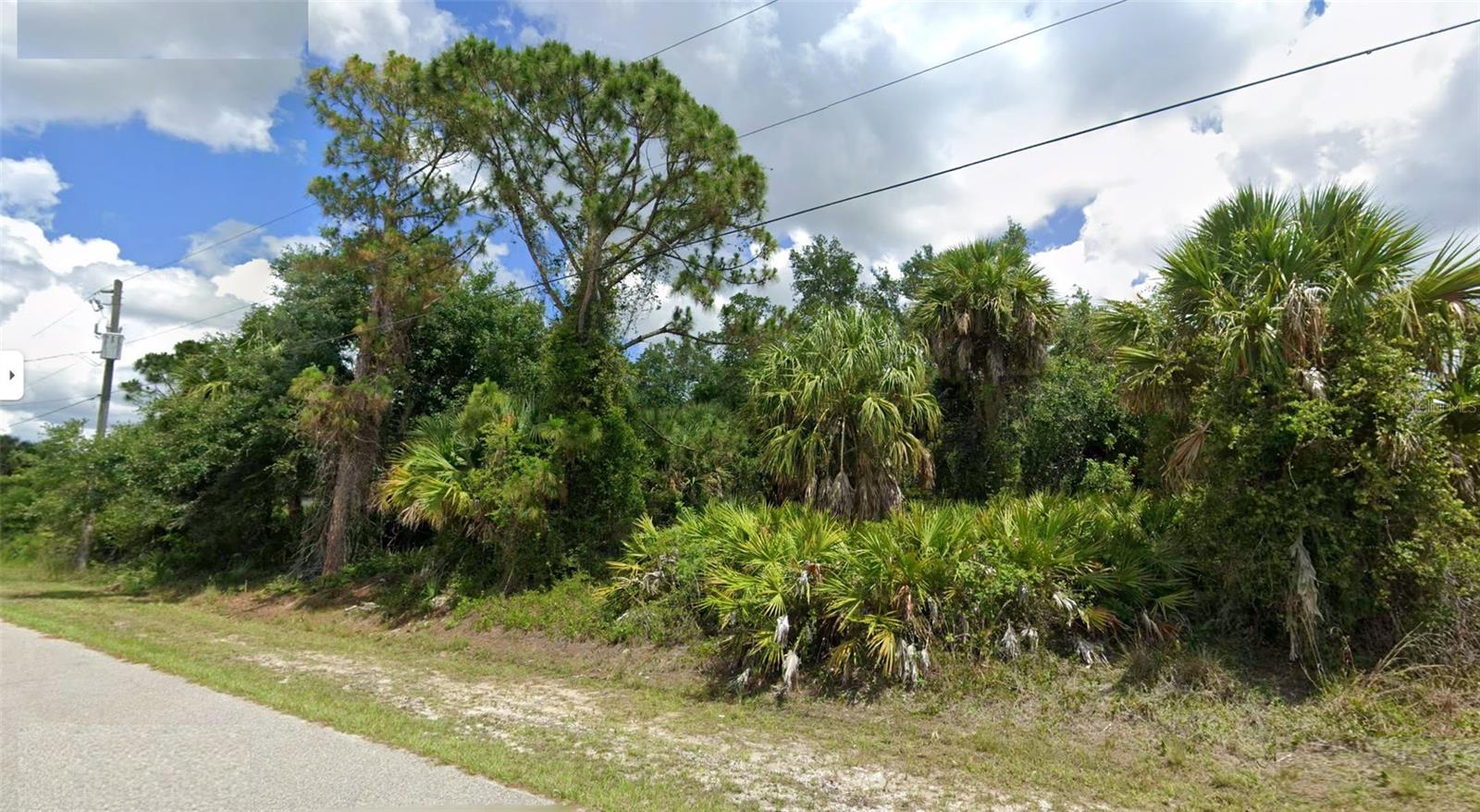 This vacant lot is priced to sell! If you are looking for a lot to build your new home this is the perfect lot for you!  Near the Snover Waterway Dam and Bridge with trails that seem to have no end!  This is a convenient location just off N. Chamberlain Blvd where you have a short drive to access I-75 for easy commutes North or South of North Port. This is a beautiful lot with 80' feet on the canal and 150' deep-plenty of room for your new home! Not only do you have easy access to the highway, but you also shopping, restaurants and parks nearby. This lot has city water available and electric on site too.