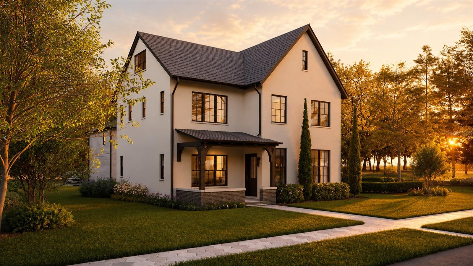 Under Construction. Unlike most new construction homes in St. Petersburg built with wood framing, this home stands apart with rare three-story solid concrete block construction. Offering a level of craftsmanship and interior finishes rarely found at this price point, every detail has been thoughtfully selected with no expense spared. Built through an exclusive collaboration between Sodus and Davis Development, this striking modern interpretation of classic Tudor architecture is designed by Place Architecture, the visionary firm behind Armature Works, The Nolen, and Grand Central Brewhouse. The main residence offers five bedrooms and five bathrooms, along with an exceptionally rare third floor that provides endless flexibility as a sixth bedroom, media room, executive office, fitness studio, or bonus living space. A welcoming foyer opens to expansive living areas with 10-foot ceilings, engineered hardwood flooring throughout, and dramatic black French doors that frame views of the backyard. The chef's kitchen is equally impressive, featuring a premium suite of Monogram appliances, Brizo plumbing fixtures, custom floor-to-ceiling cabinetry, quartz countertops, and an oversized layout designed for effortless entertaining. Upstairs, every bedroom includes its own private en-suite bathroom and spacious walk-in closet, creating comfort and privacy for family and guests alike. Behind the main residence, a detached two-car garage is topped by a fully independent 640-square-foot accessory dwelling unit complete with its own kitchen, living room, laundry, one bedroom, and one full bathroom, making it ideal for multigenerational living, extended guests, or premium rental income. Situated on a generous 50-by-129-foot lot with ample space to create a custom pool, the home is located in a non-flood zone within the highly sought-after Woodlawn neighborhood, known for its walkability, top-rated schools, and convenient access to the vibrant Fourth Street and MLK corridors. This home is currently under construction, and all photos and media are architectural renderings and floor plans intended to illustrate the home's exceptional design and vision.