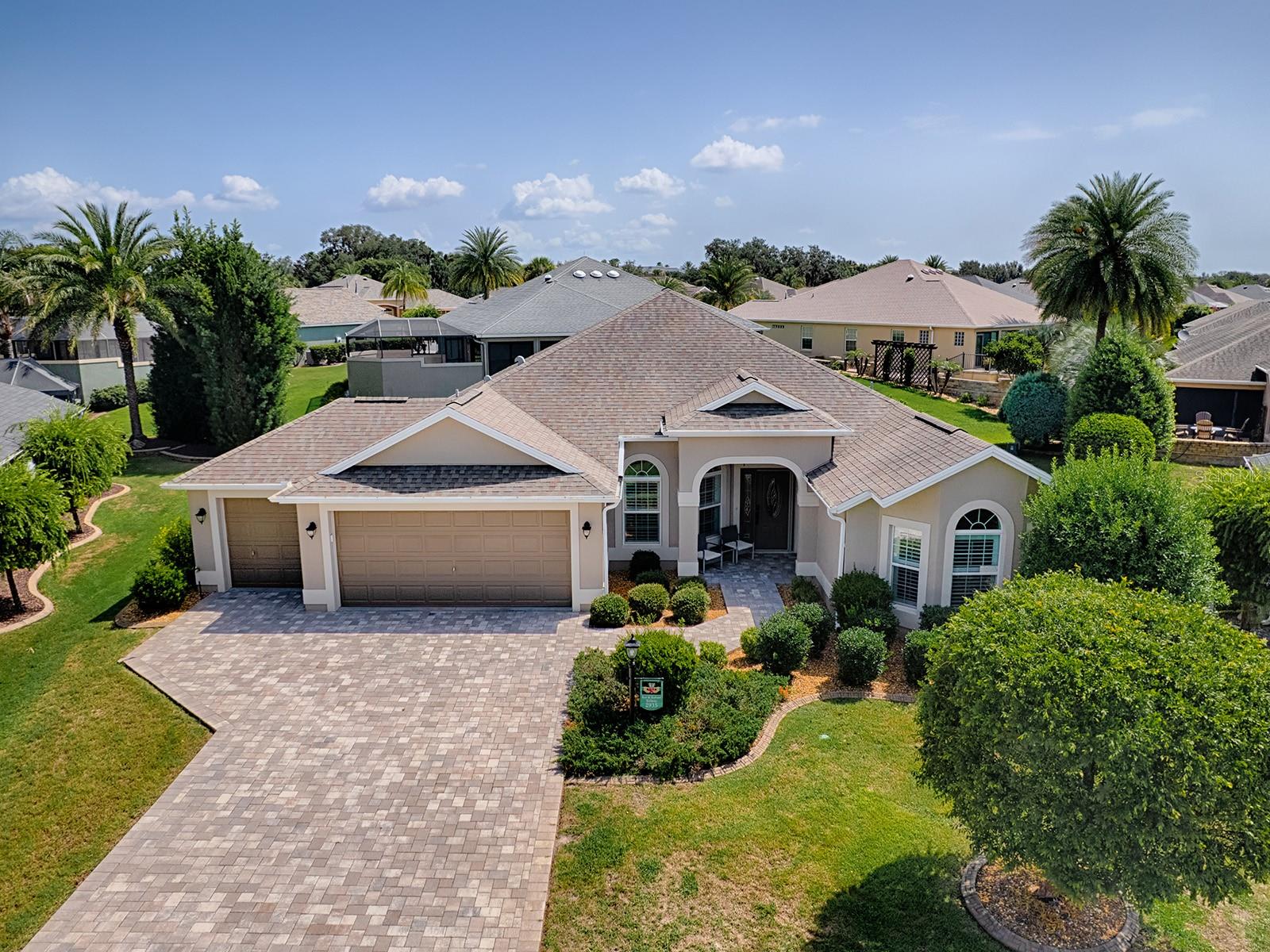 Proudly offered by the original owners, this beautiful well maintained three bedroom, two bathroom, expanded Gardenia combines quality, craftsmanship, and comfort with thoughtful upgrades  The open concept floor plan features a spacious great room and dining room combination accented by an elegant volume ceiling. The well appointed kitchen is designed for both everyday living and entertaining featuring granite countertops, decorative tile backsplash, wall oven, cooktop, breakfast bar and a bright and sunny breakfast nook with plantation shutters. Recent improvements, including a new air conditioner, new hot water heater, and mini split system, which adds an additional 390 sq. Ft. creating a comfortable year-round living space  to relax or entertain your guest.   Additional highlights include a paved driveway and walkway, an oversize two car plus a separate golf cart garage offering an abundance of  storage inconvenience.  A perfect location in the very desirable Village of Gilchrist creates the opportunity for all entertainment, recreational, golf, driving range and shopping conveniences at your fingertips!