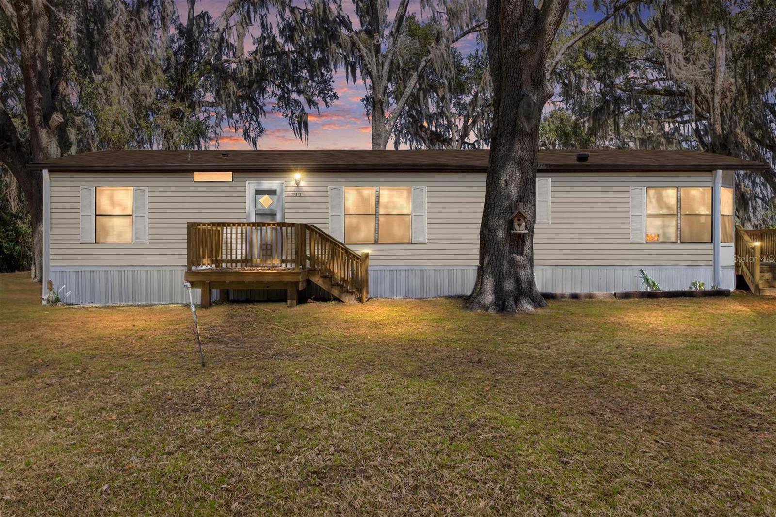 Charming Retreat – Fully Remodeled 3BR/2BA on .28 Acres, located in River Retreats in Dunnellon, Florida.  This recently remodeled 1997 mobile home offers 1,542 square feet of comfortable living space, featuring 3 bedrooms and 2 bathrooms on a spacious lot that backs up to a picturesque farm — giving you gorgeous open views and a true sense of privacy and tranquility. Step inside to find a thoughtfully updated interior with luxury vinyl plank flooring flowing throughout, a fully updated kitchen, and two remodeled bathrooms — including a primary suite with a large soaking tub, perfect for unwinding after a day on the river. The generous living area is anchored by a cozy wood-burning fireplace, ideal for Florida's cooler winter evenings. Major updates also include a new roof and HVAC system, both installed in 2025, offering peace of mind for years to come. Enjoy your morning coffee or sunsets on the recently updated exterior porch, overlooking the peaceful farmland beyond your backyard.  Nestled in the sought-after community of River Retreats, this home grants you coveted community access to the Withlacoochee River — your gateway to some of Florida's most treasured natural waterways. Paddle, boat, or cruise downriver to the world-famous Rainbow River, celebrated for its dazzling turquoise, spring-fed waters and abundant wildlife. Keep an eye out for otters, turtles, herons, and osprey as you explore this crystal-clear natural wonder or head the opposite direction to Lake Rousseau, an angler's dream known for its excellent bass fishing, along with crappie and bluegill, all set against a backdrop of cypress trees, quiet coves, and untouched Florida wilderness.  Whether you're an outdoor enthusiast, avid angler, or simply someone who craves peaceful country living with water access just minutes away, this move-in-ready home offers the best of both worlds. Don't miss your chance to own a piece of the Nature Coast lifestyle!