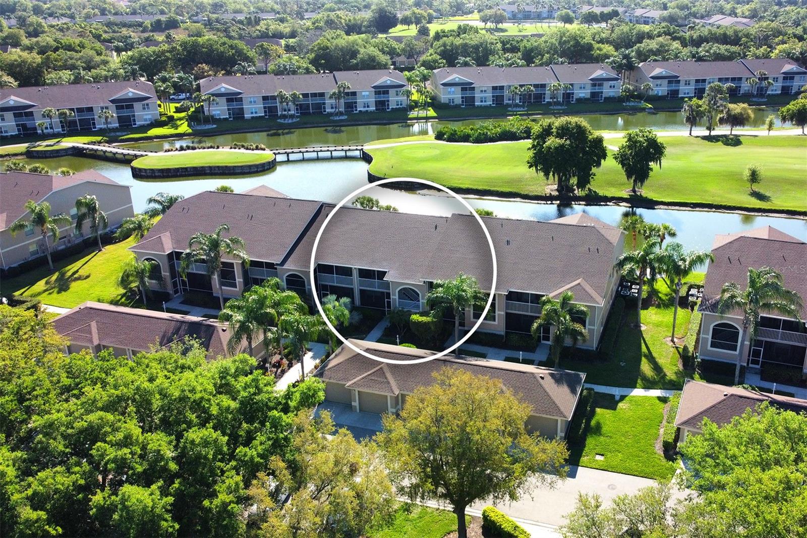 Welcome to Heritage Oaks Golf & Country Club - one of Sarasota's most spectacular private golf course communities. Take a look at this gorgeous, 2nd floor Drummond model Veranda that is being sold Turn-Key Furnished. As soon as you walk through the front door you're greeted with large vaulted ceilings, an open floor plan, and a ton of natural light making the property feel spacious and inviting. This property features 2 bedrooms, 2 full bathrooms, a detached 1 car garage, and 2 private screened lanai spaces. Take in the spectacular view from the back of the property that overlooks the bridges, tee box, fairway, and the gorgeous water surrounding the 14th Signature Hole of the golf course - it's absolutely stunning! This panoramic view over water is one of the best in the entire community! The owners of this wonderful unit have done many improvements including: a new water heater this year (2025), beautiful granite countertops in the kitchen, stainless steel appliances, gorgeous tile backsplash, neutral interior paint, and some beautiful coastal furnishings. Imagine yourself enjoying a cup of coffee on your two private lanai spaces and taking in the abundance of wildlife that roam this Certified Audubon Neighborhood. Heritage Oaks is conveniently located near I-75 and a short drive to all things in Sarasota - dining, beaches, theater, arts, the Gulf of Mexico, and so much more! Heritage Oaks is known for its pristine 18-hole golf course, har-tru tennis courts, fitness center, 24-hour security, an impressive clubhouse with 2 restaurants including the recently renovated and spectacular 19th Hole Lounge, 5 heated swimming pools, and a calendar of events packed with activities. Come take a tour of this wonderful property today!