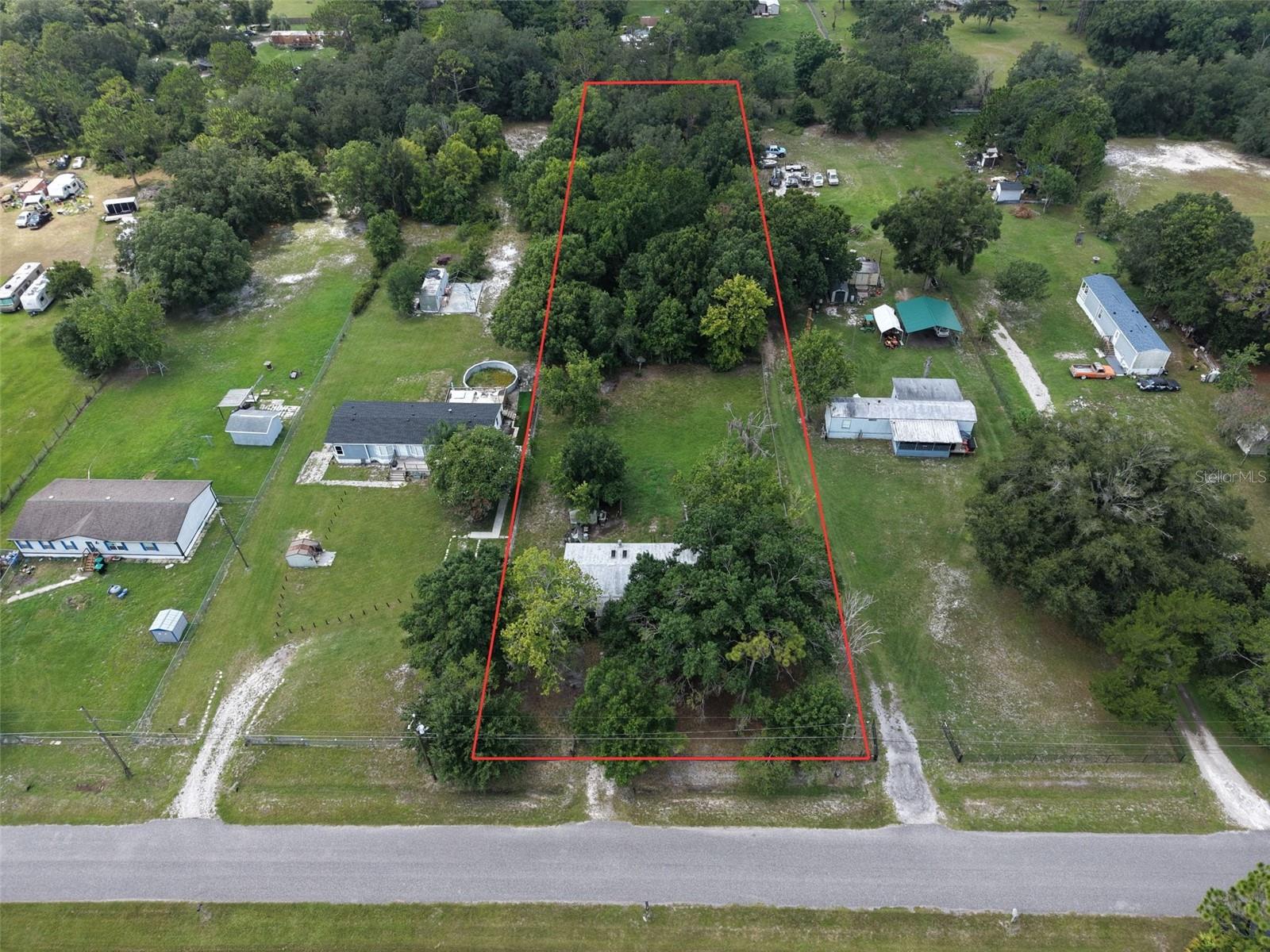 Here is your chance to own 1.2 acres of land with a 1981 3 Bedroom / 2 Bathroom Doublewide Mobile Home Included. Come enjoy this beautiful piece of property tucked in the very back of a quiet neighborhood. Located in the fast-growing East Orlando area. The home was manufactured in 1981 and needs work. Has a Well and Septic tank unknown condition. Big back yard plenty of room for animals or other buildings. Property is near UCF, Waterford Lakes area, Avalon Park Blvd. Schedule you're showing today!