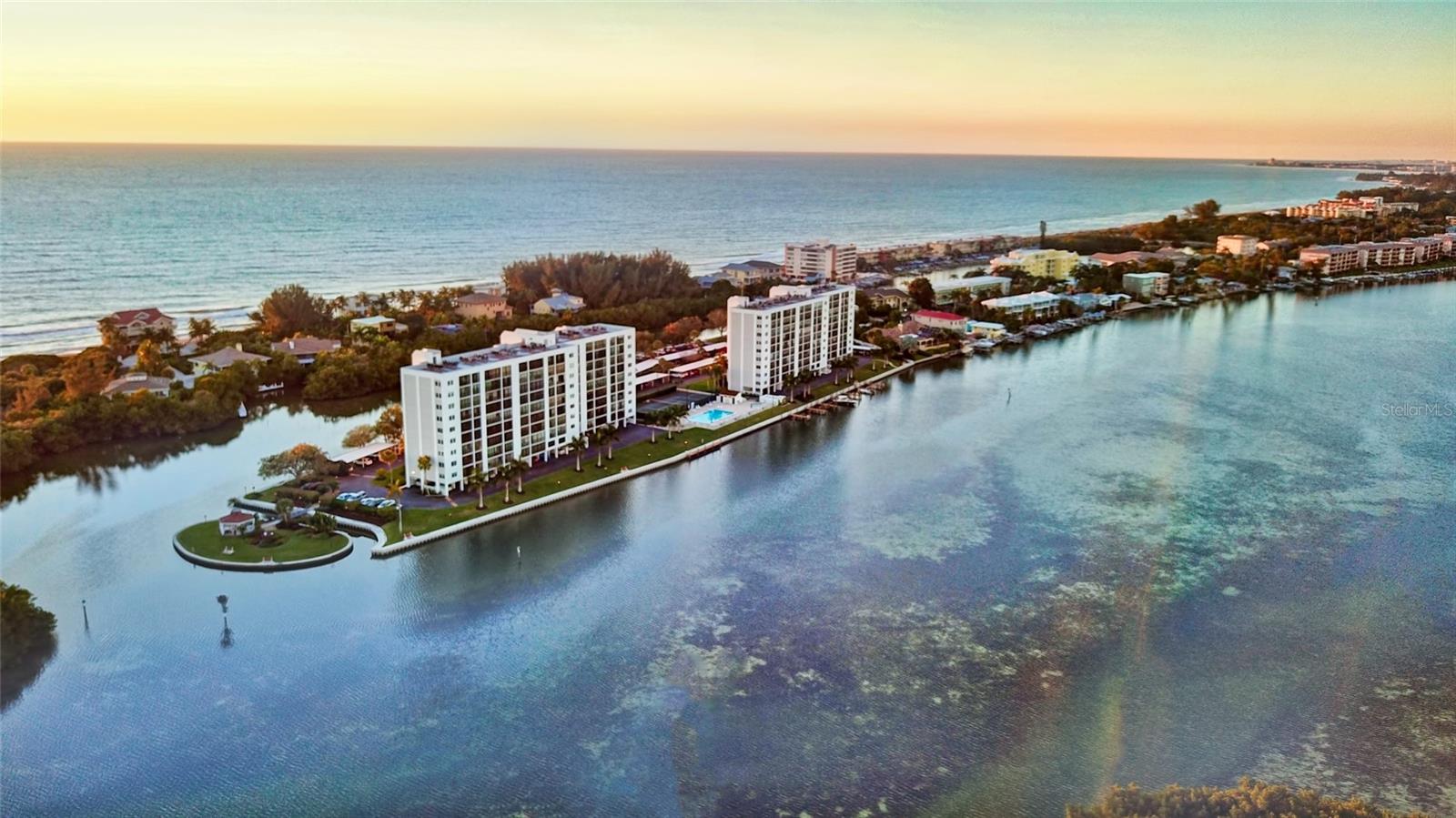 Your opportunity is here!  The Penthouse perched on the top 10th floor, offers unparalleled 180-degree views of the Gulf of Mexico and Intercoastal Waterways.  From sunrise to sunset, this condo captures the essence of coastal living.  Step inside to discover a refreshed and elegantly staged interior.  The one-bedroom ensuite, with its eastern water views, provides a tranquil retreat, while the spacious bathroom provides two private entrances.  Easy-to-maintain hard surface flooring enhances the light and airy feel, seamlessly connecting to the enclosed lanai–a 22-foot-long glass-enclosed oasis that frames panoramic multi-waterway views. Convenience is ensured with assigned under-building parking, a dedicated 1st floor storage area & dual building elevators. Nestled in the historic southern tip of Siesta Key Island, this iconic gated community spans over 5 acres of natural beauty. Stay active in the fitness room, complete with men’s and women’s saunas. Enjoy the heated lap pool & spa.  Boat docks are available for water enthusiasts and kayak storage and launch facilities make exploring the vast waterways a breeze.  Lighted tennis and pickleball courts invite friendly competition and you can cross the bridge to a private island where BBQs, butterfly garden and fishing await. The Community Club House is a hub for social gatherings and onsite property management and maintenance provide peace of mind.  Don’t miss the chance to embrace this coastal luxury opportunity.  Contact me today for your private showing!