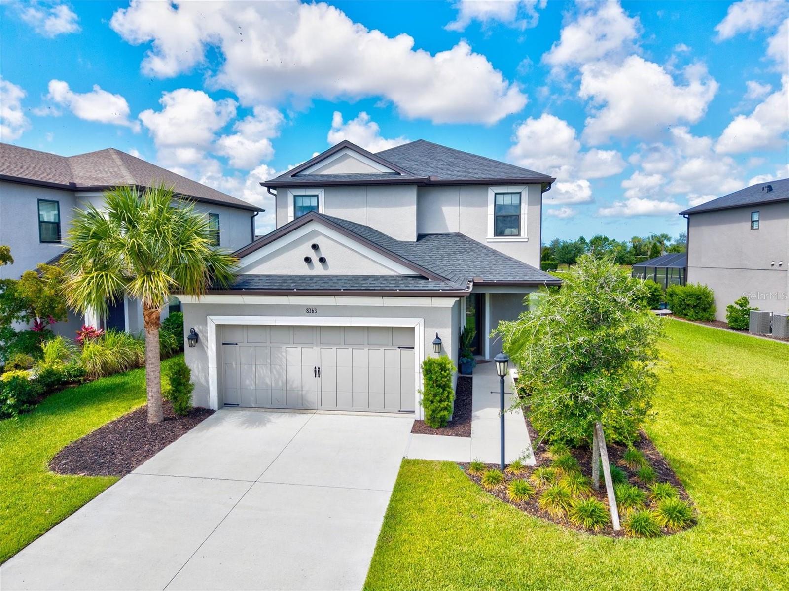 Welcome to this beautifully upgraded Anastasia model in highly sought-after Skye Ranch, perfectly situated on a premium oversized lakefront lot with exceptional privacy and stunning water views.

Offering nearly 3,000 square feet of thoughtfully designed living space, this 4-bedroom plus office, 3.5-bath home combines luxury upgrades, functionality, and modern design throughout. The open-concept floorplan features soaring ceilings, beautiful railing details, expansive living spaces, and abundant natural light showcasing serene lake views from the main living areas.

This home has been extensively upgraded beyond builder standards, including luxury vinyl plank flooring throughout the entire home with no carpet, upgraded oak staircase, 8-foot solid wood interior doors, matte black upgraded hardware throughout, custom lighting fixtures, ceiling fans throughout the home, and custom shades throughout including motorized shades over the expansive triple pocket sliding glass doors.

The gourmet gas kitchen is beautifully appointed with upgraded Café Series appliances, generous entertaining space, and seamless flow into the dining and living areas overlooking the private backyard and lake. The dedicated front office/flex room was upgraded to provide an ideal work-from-home space with privacy and functionality.

Upstairs, an additional open loft/den seating area provides flexible living space perfect for a secondary living room, media space, playroom, or relaxation area.

One of the standout features of this property is the oversized premium homesite, approximately 20% larger than many Anastasia lots within the subdivision, offering a rare sense of openness and privacy. The backyard features aluminum privacy fencing, lush mature privacy landscaping, tranquil lake views, and ample room to add a custom pool while still maintaining generous green space.

Designed for indoor-outdoor Florida living and entertaining, the covered lanai features a fully equipped outdoor kitchen complete with vent hood for grilling and backyard entertaining, creating the perfect space to enjoy lakefront sunsets and gatherings year-round.

Additional upgrades include whole-home Ethernet wiring in every room, whole-house water filtration system, reverse osmosis system at the kitchen sink, freshly painted exterior, and gutters installed around both the first and second stories for added functionality and protection.

Located within the highly desirable Skye Ranch community, residents enjoy resort-style amenities including pools, parks, trails, fitness amenities, playgrounds, and top-rated Sarasota schools, all conveniently located near shopping, dining, Siesta Key Beach, and I-75.

This is a rare opportunity to own a premium upgraded lakefront home with privacy, technology upgrades, designer finishes, outdoor entertaining space, and one of the most desirable lots in Skye Ranch. Seller willing to contribute toward closing costs or interest rate buydown with acceptable offer.