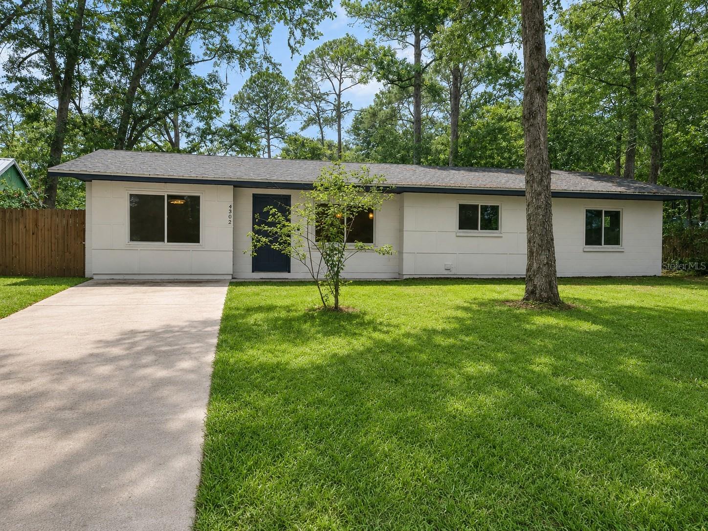 One or more photo(s) has been virtually staged. There's something refreshing about walking into a home and knowing the hard work is already done. Tucked at the end of a cul-de-sac in a well-established neighborhood, this 3-bedroom, 2-bath home was fully remodeled in 2024. Nearly every surface and system was updated along the way to create a home that is modern, stylish and practical for everyday living. From the moment you walk through the door, the home feels open, connected, and easy to live in. The kitchen sits at the center of it all with quartz countertops, updated cabinetry, and a clean modern finish that sets the tone for the entire space. The living and dining areas flow naturally around it, creating a layout that feels welcoming without being overwhelming. Everyday living was clearly considered here. The secondary bedrooms provide comfortable space with built-in closet systems, while the primary suite features a walk-in closet and an ensuite bath with dual vanities. A large laundry room includes built-in cabinetry and a sink, giving it a level of function that makes daily routines simpler and tends to get overlooked in similar homes. Step outside and you'll find one of the home's biggest surprises: a large backyard with room to spread out, host weekend cookouts, let pets play, or finally start that garden you've been thinking about. What truly sets this home apart is everything already done for you. Nearly every major system has been updated, including the roof, windows, HVAC, plumbing, electrical, tankless water heater, and whole-house water filtration system. Instead of spending your weekends planning renovations, you can spend them enjoying your new home from day one.