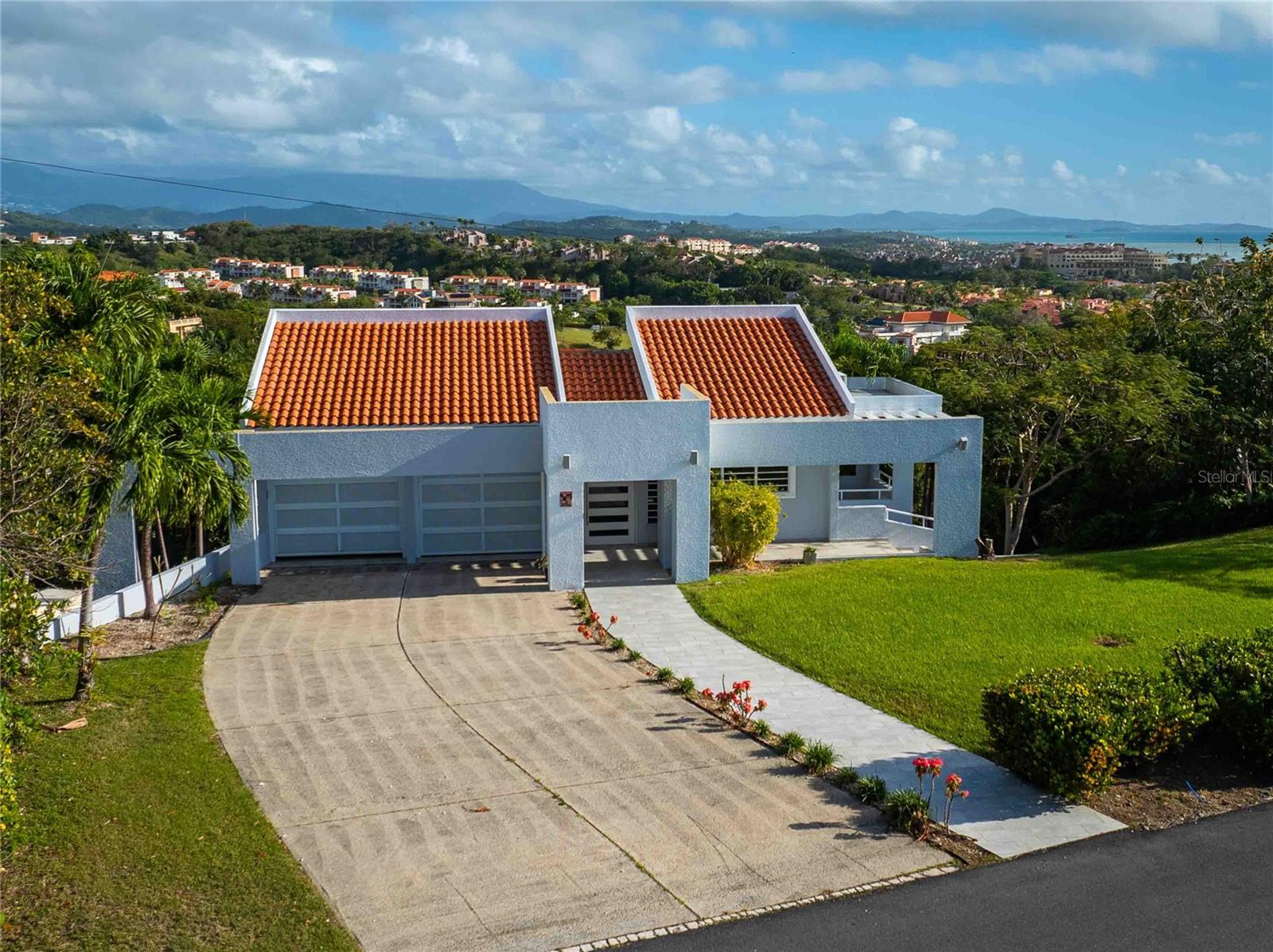 One or more photo(s) has been virtually staged. Priced UNDER Appraisal! Located in the highly sought-after Port Road in Palmas del Mar, this residence offers a unique opportunity to own a prime property within one of Puerto Rico’s premier resort communities. Ideally situated, the home enjoys expansive views and a privileged setting that combines privacy, comfort, and resort-style living.

The interior layout is designed for both everyday living and entertaining, featuring bright, open-concept spaces with seamless indoor-outdoor flow to maximize natural light and tropical breezes. The property provides a strong foundation for customization or enhancement, depending on the buyer’s vision.

Offered below appraisal value, this home is competitively positioned for a timely sale—an exceptional opportunity for buyers seeking location, value, and long-term investment potential in Port Road, where availability is limited.

Residents of Palmas del Mar enjoy access to world-class amenities including golf courses, marina, tennis center, restaurants, preK-12th grade school, and more, all within a gated community with 24/7 security. Golf, tennis/pickelball, and beach club are part of a separate membership with the Palmas Athletic Club.

Property details: 2,073 m² lot (0.51 acres), 2,236 sq. ft. interior living space, 4,581 sq. ft. total construction (including terraces and two-car garage). HOA: $1,300/year. Property taxes: $2,632/year. Includes 20k diesel generator.

Motivated Seller! Bring your offers!