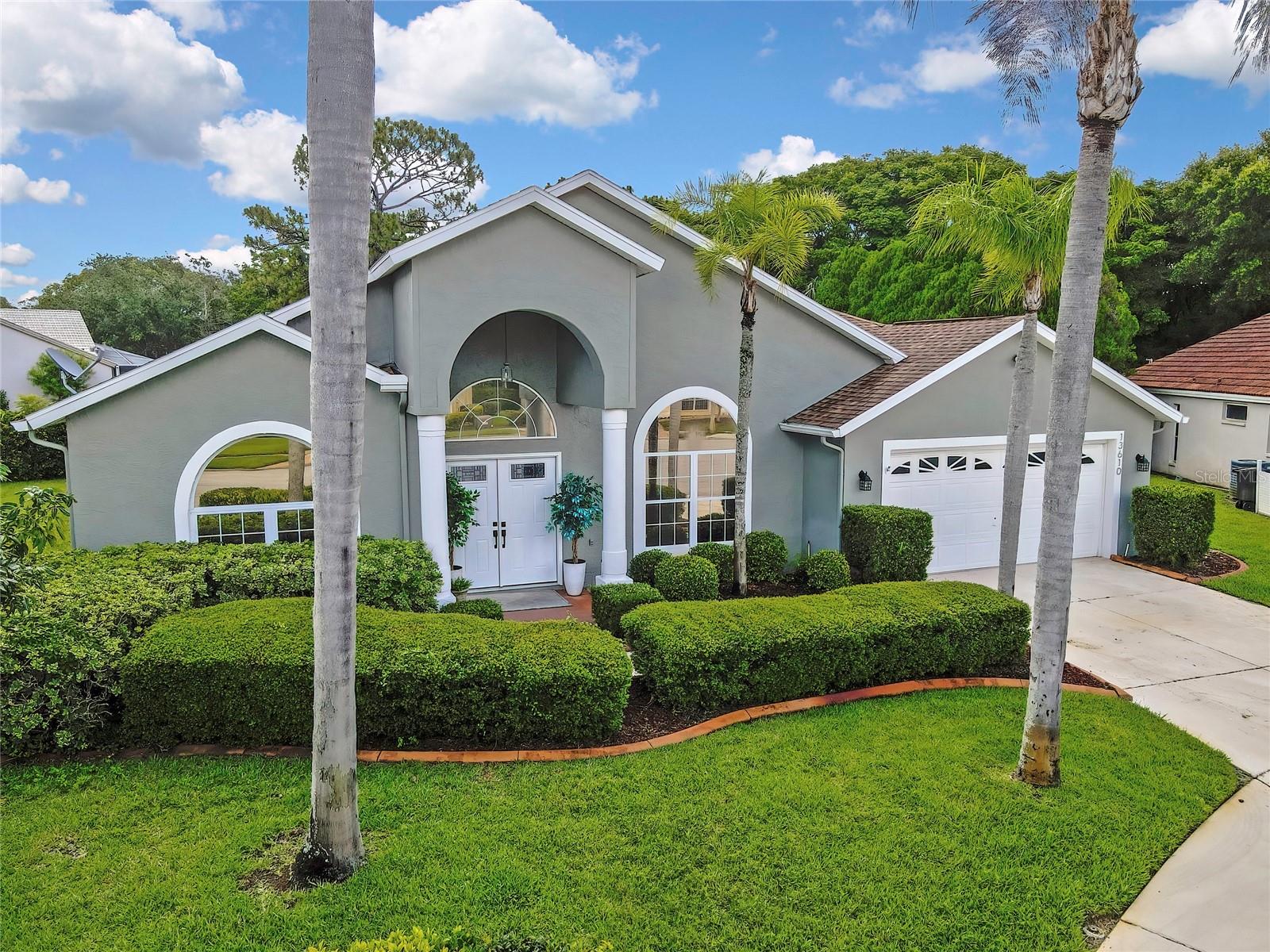 Welcome to this beautifully updated ranch-style home nestled on a quiet cul-de-sac in desirable Hudson. This 4 bedroom, 3 full bath, 2 car garage home is MOVE-IN READY!  From the moment you enter, your eyes are immediately drawn through the sliding glass pocket doors to the tranquil rear pool patio, where lush landscaping, colorful garden planters, and a soothing outdoor oasis create the perfect backdrop for Florida living.  Inside, the home showcases a unique and cohesive design with cathedral ceilings painted in the same soft tones as the walls throughout, creating an open, airy, and polished feel. The spacious floor plan offers a seamless flow between the living areas, ideal for both entertaining and everyday comfort. Just off the entry is a versatile front office or den, positioned across from the formal dining room.
The beautifully updated kitchen is the heart of the home, featuring granite countertops, a stunning stone backsplash, re-faced cabinetry with updated hardware, under-counter lighting, a breakfast nook, and a charming dedicated coffee station. Additional kitchen upgrades include a new dishwasher and garbage disposal. Two secondary bedrooms located off the kitchen share a thoughtfully designed Jack-and-Jill bathroom, each with pocket doors for privacy and separation. The bathroom has been fully updated with quartz countertops, wood-look ceramic tile flooring, and a tub/shower combination. A third guest bedroom is paired with a truly distinctive bath featuring cedar tongue-and-groove ceiling, full tiled walk-in shower, creating a spa-inspired retreat for family or guests.  The private primary suite offers a warm and relaxing atmosphere with a large walk-in closet and spacious en-suite bath complete with a walk-in shower, separate spa tub, private water closet, and generous storage space.  Additional interior improvements include tinted front and primary bedroom windows, updated lighting and ceiling fans, fresh interior paint and trim, luxury vinyl plank flooring throughout the main living areas, new carpet in all bedrooms, new closet doors in the primary suite, and ceramic wood-look tile flooring in the primary bath. The laundry room is equally functional with a utility sink and abundant cabinet storage. Step outside and enjoy your own backyard paradise featuring a sparkling 10-foot-deep pool surrounded by beautiful teak decking, refreshed lanai screens and paint, and vibrant garden accents that make this outdoor space truly special.  Major updates provide added value and peace of mind, including a new HVAC system with air handler and cleaned ductwork, freshly painted exterior and trim, new sprinkler heads and pump, new double front doors with trim, and a garage enhanced with additional cabinetry, shelving, and a freshly painted floor.  This exceptional home reflects true pride of ownership and remarkable attention to detail throughout. The only thing missing is YOU.