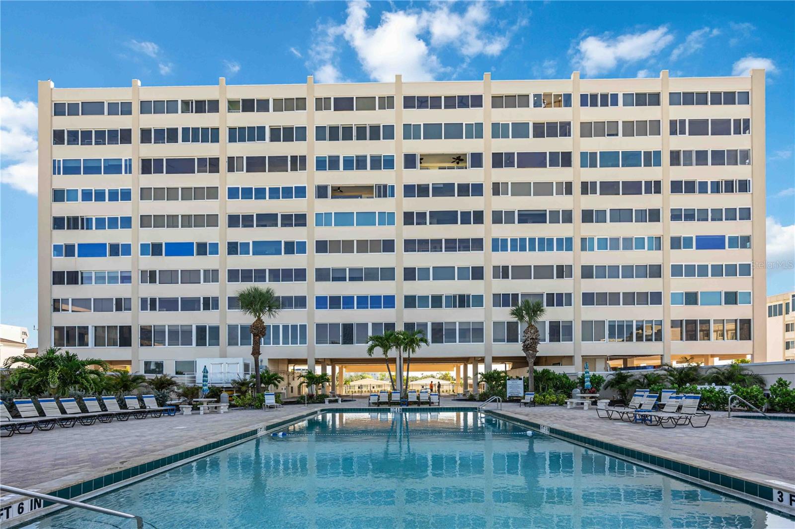 Nestled on the renowned shores of Siesta Key, Horizons West offers a truly exceptional waterfront living experience where breathtaking panoramic views and unforgettable sunsets become part of everyday life. This meticulously cared-for two-bedroom, two-bathroom residence, elevated on the sixth floor, delivers unparalleled luxury and privacy in a home that has never been in a rental program, resulting in exceptionally minimal wear and tear. Following a comprehensive top-to-bottom renovation that stripped the unit to its concrete box, every inch of this residence reflects the pride of true ownership with timeless, sophisticated design. The gourmet kitchen and bathrooms feature custom Harlan solid wood cabinetry sourced from Indiana, sleek granite countertops, and a premium suite of KitchenAid stainless steel appliances. Modern infrastructure is seamlessly integrated throughout, including Cat 6 data outlets, a commercial-grade PakEdge Wi-Fi router, and a whole-home surge protector. Comfort is guaranteed with a brand-new HVAC system installed in July 2025, complete with an air scrubber for active air purification. The home is an audiophile’s dream with a built-in multi-zone sound system featuring Vienna Acoustics speakers and a Marantz receiver. Elegant touches abound, from recessed LED and runway lighting to motorized Hunter Douglas window treatments and custom California Closets. Offered turnkey and fully furnished, the residence includes high-end pieces like an American Leather sofa and Westin Heavenly Bed® mattresses, along with the rare convenience of a roughed-in space for an in-unit washer and dryer. Horizons West spans 11 acres with over 300 feet of deeded beach access, a beachside pool and spa, and a serene bay-side park with a day dock. This is a rare opportunity to own a residence finished to the highest standard on the world-renowned shores of Siesta Key. Welcome home.