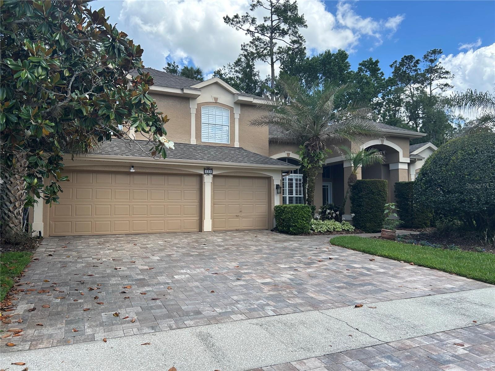 Pride of ownership is evident throughout this beautifully updated, move-in ready, one-owner home in highly sought after Winding Hollow in Winter Springs.  The ideal 2 story floorplan offers 4 bedrooms & 3 full baths plus a bonus room & 3 car garage. This home showcases timeless style, thoughtful updates and versatility w/ tile floors throughout the downstairs & laminate wood up. The open concept, bright & modern floorplan, has great flow & is perfect for entertaining with open formal living & dining rooms w/ high ceilings, creating an inviting sense of space. Continuing on you enter the heart of the home; the updated island kitchen, perfectly positioned to the breakfast nook & impressive family room w/ 18' soaring ceilings & high glass windows; ideally suited for preparing meals while staying connected w/ family & guests. The kitchen features beautiful granite countertops, plentiful wood cabinet space w/ pull out drawers, pantry, modern s/s appliances & access to the garage & utility room, which features a large storage closet. The spacious 1st floor primary suite offers a sitting area, 2 walk-in closets & an updated en-suite bath featuring a relaxing & modern soaking tub, glass shower, & quartz vanity w/ dual sinks; completing your luxurious private retreat. The 1st floor, split plan bedroom 2 & full bath, are off the rear of the family room & set up as a private suite; perfect for guests or for multi-generational living. The upstairs access is provided by a beautifully upgraded stairway feature w/ laminate wood flooring, leading to bdrs 3 & 4, a hall full bath, & a balcony bonus room / flex space that could be converted to 5th bedroom, it already has a walk in closet, media room, playroom, home gym & overlooks the downstairs kitchen & family room. More features the expansive tile floored screened lanai for enjoying Florida living year-round & overlooking the private & lushly treed back yard; the lanai is accessible from the formal living room, primary suite & the family room. Additional highlights include a spacious 3 car garage w/ overhead storage & expanded brick pavered driveway to accommodate more cars; newer roof, & 2 zoned A/C, & plantation shutters thru-out the home. Ideally located with-in walking distance of the Cross Seminole trail & Central Winds Park & offering convenient proximity to wonderful Winter Springs schools, shopping, dining and  SR 417 and 17-92; this exceptional home will exceed your expectations...welcome home!