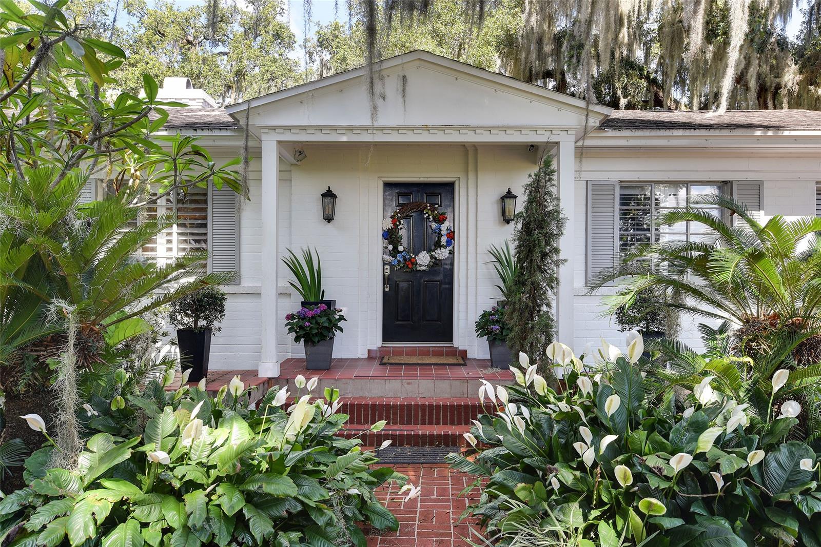 Gorgeous Lake Front Classic Florida Ranch set among mature oaks on 2.25 acres near downtown Orlando. Unique "Estate" sized property with dock, covered boat slip and rare 2nd story deck over the water. Spacious living areas open onto the large deck with lake views and Florida breezes. Light filled eat-in kitchen with lake views. 4 ensuite bedrooms include two opportunities for master bedrooms. Large living room with fireplace connects to an even larger lake view family room and formal dining room. Bonus areas include large storage room adjacent to the two car garage as well as a screened lake view deck. In addition to the main home there is a large, separate lake front "surf shack" with a garage door and space for boat parking or for use as a lake front cabana. Be sure to check out the Photos and Virtual Tour to fully appreciate the potential for this unique property. ;Water: City