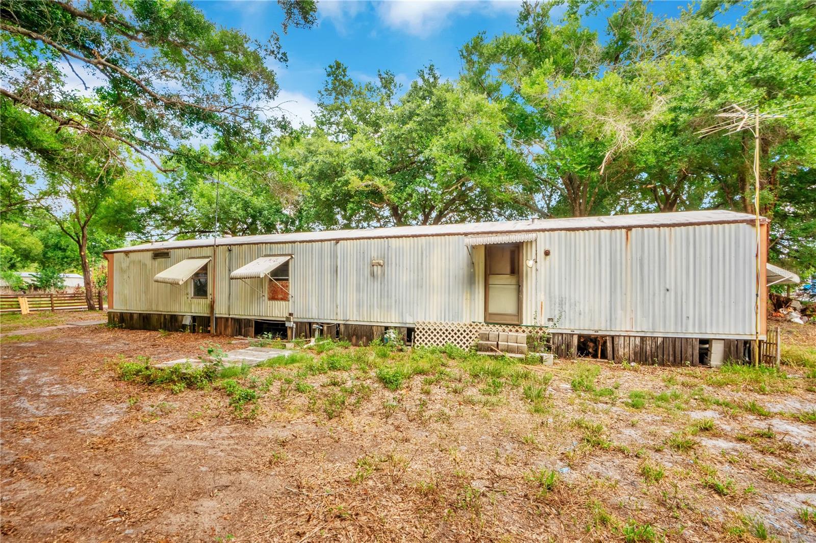 Single wide mobile home situated on a spacious half acre double lot lot with two storage sheds offering plenty of extra storage space. Property is in need of repairs and updates. This is an ideal opportunity for investors, flippers, or buyers looking for a project. Plenty of potential to make it your own!