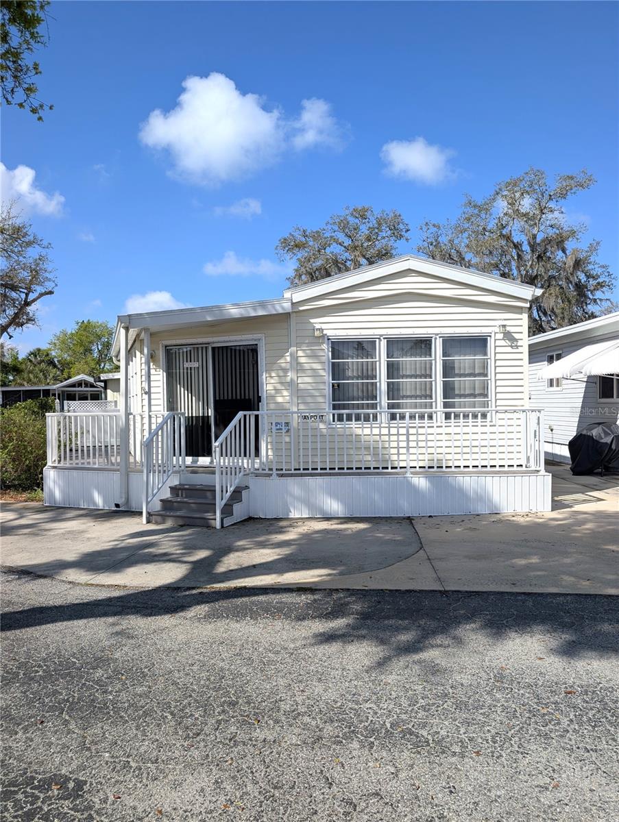 Welcome to Sugar Creek Resort! A 55+ community full of vibrant activities for those that like to stay active. This community features pickleball, tennis, large heated pool, shuffleboard, miniature golf, a billiards room and so much more! Come see this adorable mobile home it's small but can meet all of your snow bird needs. This unit in in a cul-de-sac and sits on a corner lot with green space and foilage on one side. The cul-de-sac features additional green space where neighbors meet and enjoy getting to know each other. Come make new friends and enjoy the Florida winters.
