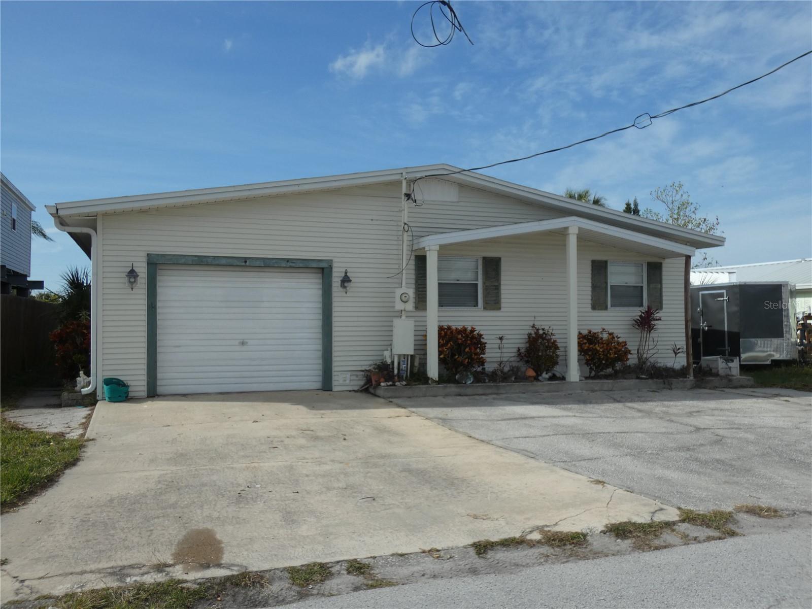 Boating, Fishing, Waterfront Paradise! 3 Bedroom, 3 bath, Attached 1 car garage too. Large dock and approximately 15,000 lb boat lift & tide slides, plus davits for small boat or jet ski. Bring your boat and enjoy the Florida Gulf Coast Lifestyle! Relax in your fenced back yard with sunsets. 1 car garage attached with workshop & entertaining options. Signal Cove Association optional for $220.00 yearly with access to private boat ramp. Three car parking pad. Built in stereo speakers in Kitchen Living room area.No blind offers! Seller says cash only please.
