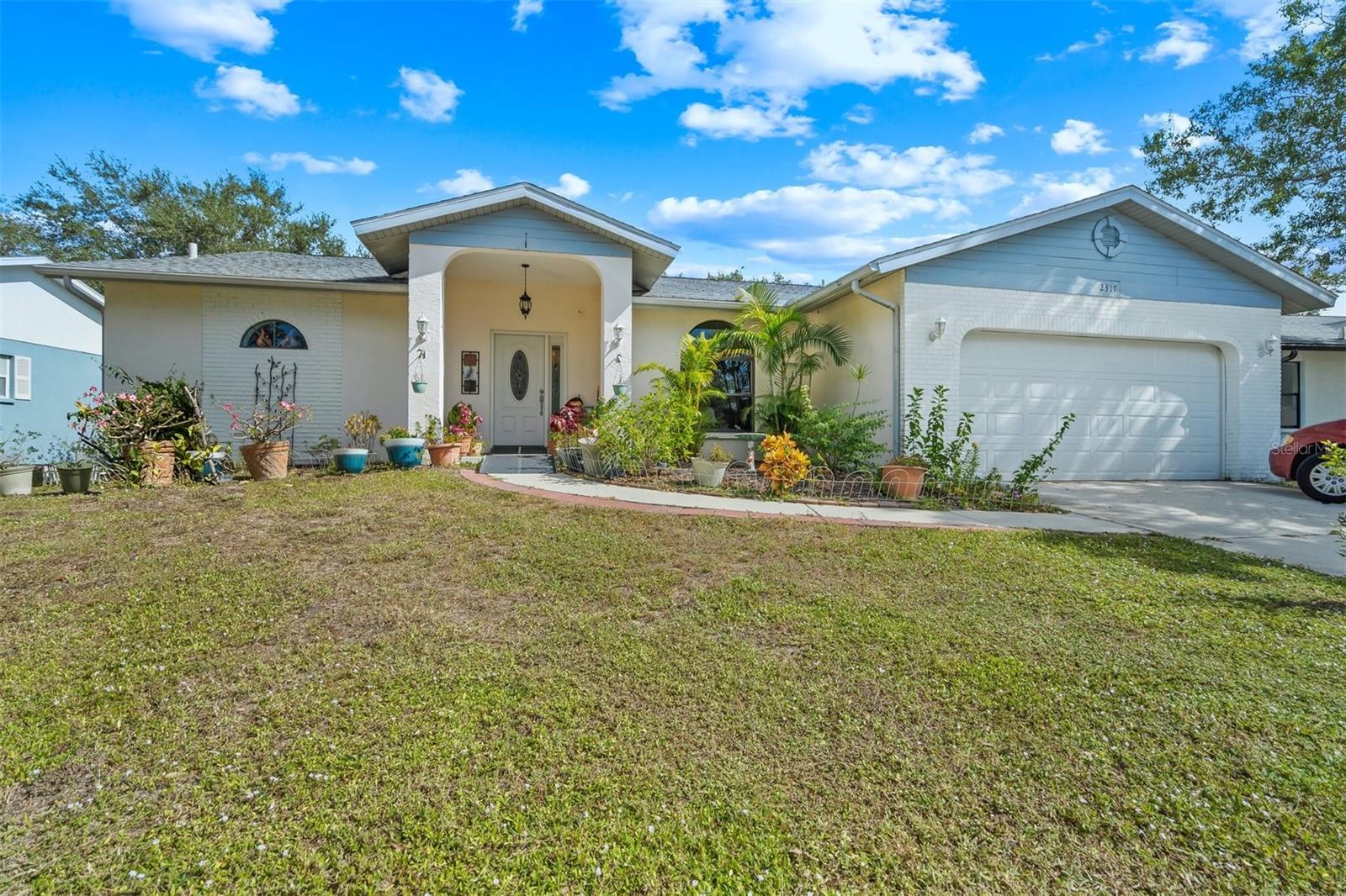 Lovely 3 bedroom 2 bath pool home with fantastic view of lake in Colonial Oaks.
This home has been meticulously maintained by the owners. Roof replaced in march of 2017, Newer HWH, New 22-inch tile flooring throughout
the home, including Main bedroom. The two other bedrooms are spacious and bright with carpet.
As you enter the home in to the foyer and living room you have a great view of the lanai and newly resurfaced pool with long lake views.
The living room has vaulted ceilings and sliders out to the lanai. The adjacent Main bedroom is also spacious and also has sliders out to the lanai.
In the kitchen you will find solid wood cabinets and soft close drawers, beautiful granite counters and newer appliances. Beyond the kitchen is a large family room with vaulted ceilings and sliders to the lanai, again with long lake views. There are 2 additional split bedrooms with shared bath. The bathrooms both have stand up showers and tile flooring. You can enjoy your morning coffee or evening glass of wine in the tranquility of the lanai with private setting and lake view. Colonial Oaks is a very friendly community with park just steps from this home. Don't wait for this home to be sold to someone else. Make your showing appointment today.