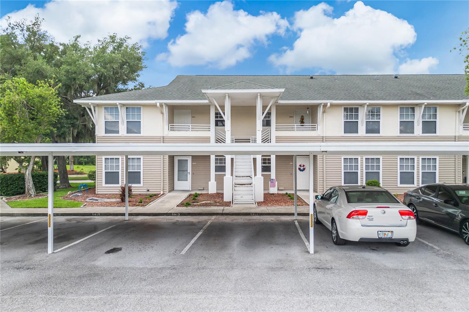 Welcome to 5913 Topher Trail, a beautifully maintained 2-bedroom, 2-bathroom condo offering comfort, convenience, and exceptional value in the heart of Mulberry. Featuring a desirable split-bedroom floor plan, this home provides both privacy and functionality, making it ideal for first-time buyers, downsizers, seasonal residents, or investors. Step inside to discover vaulted ceilings that create a bright and spacious atmosphere throughout the main living areas. The kitchen is equipped with new appliances and offers plenty of space for everyday living and entertaining. The open layout flows seamlessly into the living and dining areas, while the screened-in porch provides the perfect place to relax and enjoy Florida’s beautiful weather year-round. Conveniently located with easy access to major roadways, this home is just a short drive from Downtown Lakeland, known for its vibrant dining scene, boutique shopping, entertainment venues, and picturesque Lake Mirror. You’ll also appreciate being near Lakeland Linder International Airport, medical facilities, golf courses, parks, and recreational opportunities throughout Polk County. Offering low-maintenance living in a convenient location, this move-in-ready condo presents an excellent opportunity for anyone seeking affordability, comfort, and accessibility. Competitively priced and ready for its next owner, this is one you won’t want to miss. Schedule your private showing today!