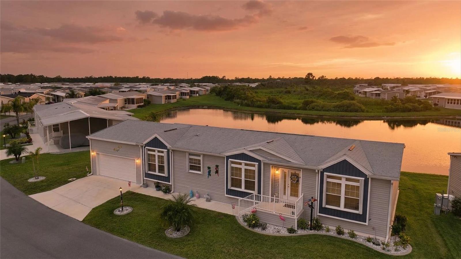 Experience elevated Florida living in this beautifully upgraded 2023 Silver Springs Premier home, perfectly situated on a tranquil pond-view homesite in the sought-after gated 55+ community of The Preserve. Offering approximately 1,920 square feet, this thoughtfully designed 2-bedroom, 2.5-bath home with a versatile den/office combines quality construction, modern finishes, and peaceful waterfront views.

The bright, open floor plan is enhanced by luxury vinyl flooring, tray ceilings in the living room, dining area, and primary suite, transom windows that fill the home with natural light, and French doors leading to a fully enclosed glass lanai overlooking the pond. Whether you're entertaining guests or enjoying a quiet morning coffee, the seamless indoor-outdoor living spaces make the most of the beautiful Florida setting.

The stunning kitchen is designed for both everyday living and entertaining, featuring quartz countertops, a large center island, farmhouse sink, upgraded Whirlpool stainless steel appliances, custom cabinetry, tile backsplash, designer range hood, and a walk-in pantry with a decorative barn door.

The spacious primary suite easily accommodates a king-size bedroom set and features a luxurious ensuite bath with dual quartz vanities, extensive built-in storage, a large walk-in closet, and an oversized tiled walk-in shower. A generously sized guest bedroom, flexible den that's perfect for a home office or hobby room, convenient half bath, and dedicated laundry room complete the thoughtfully designed interior.

Additional upgrades include:
• Oversized 20' x 30' two-car garage
• Accordion hurricane shutters
• Five ceiling fans
• Upgraded faucets and fixtures
• ADA-height toilets
• R-30 insulation for added energy efficiency
• Beautifully landscaped yard with outstanding curb appeal • 

Step outside to your enclosed glass lanai and adjoining patio, where you'll enjoy peaceful pond views and abundant Florida wildlife right from your backyard.

Residents of The Preserve enjoy an active, resort-style lifestyle with exceptional amenities, including:
• Gated entrance
• Resort-style clubhouse
• Heated pool & spa
• Pickleball & tennis courts
• Shuffleboard
• Dog park
• Walking trails
• Fishing lakes
• Active social calendar • 

Conveniently located just minutes from shopping, dining, medical facilities, golf, and major travel routes, this move-in-ready home offers the perfect combination of luxury, comfort, and low-maintenance Florida living.