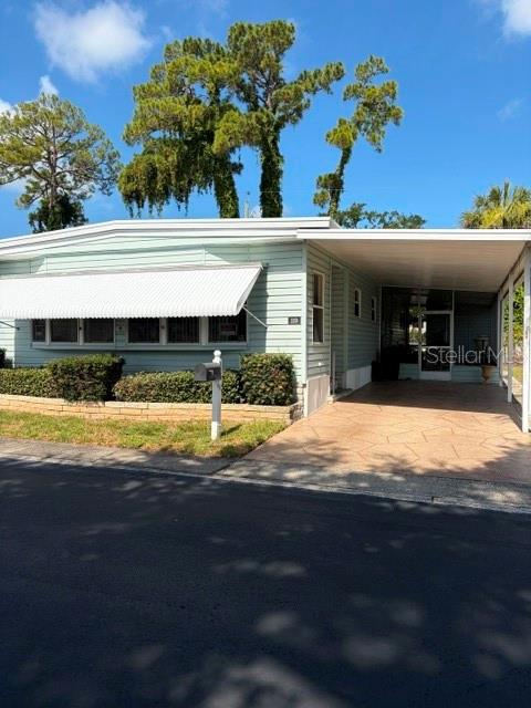 Manufactured home in 55+ community, it is a fee simple community! This home features 2 bedroom, 2 bath manufactured home and located in Dunedin, Florida. This home also features an enclosed front porch.  Close to the Blue Jays Field, bowling alley and bike trails.  HOA fee of $220 per month, covers your water, sewer, garbage and pool maintenance.  There is a washer/dryer hookup in the carport outside for your convenience.  You can enjoy the community pool, clubhouse and other amenities!