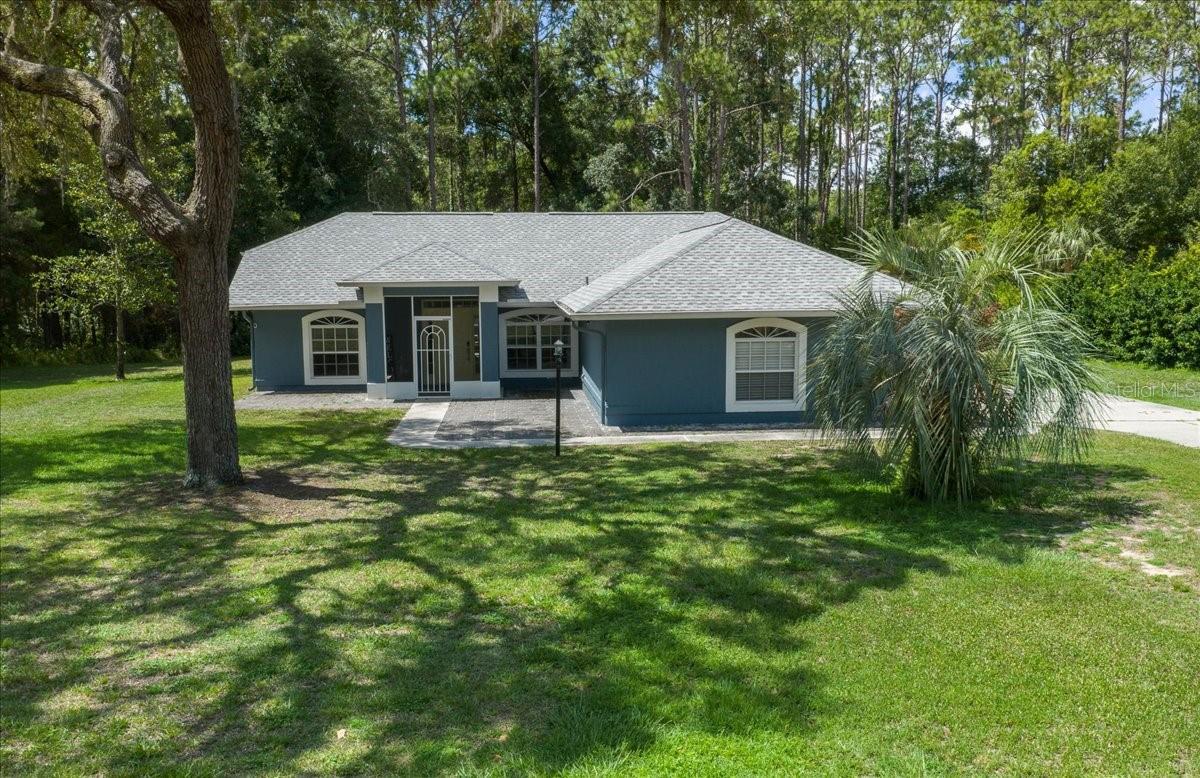 Meticulously maintained & move in ready, this 3 bedroom, 2 bath pool home offers 1,626 square feet of living space, a 2 car garage, and is situated on a spacious 1 acre lot in the quiet community of Citrus Hills. With approximately $50,000 in upgrades since the current owners purchased the home, this property has been thoughtfully updated and beautifully cared for. As you step inside, you are welcomed by an open floor plan featuring vaulted ceilings, luxury vinyl plank flooring throughout, and an abundance of natural light. The stunning kitchen offers plenty of cabinet and counter space, granite countertops with a waterfall edge, and stainless steel appliances, making it perfect for both everyday living and entertaining. Large primary suite features a walk in closet, an en suite bathroom with a double vanity and tiled walk in shower, plus direct access to the pool area through a private door. The split floor plan provides privacy, with two generously sized guest bedrooms located on the opposite side of the home and a guest bathroom conveniently situated between them featuring a tiled tub/shower combination. Sliding glass doors lead to the large screened pool area, where you’ll find a saltwater pool that is perfect for enjoying Florida’s warm weather year round. The backyard is fully fenced for pets and backs up to wooded land, providing additional privacy and a peaceful setting. Conveniently located near shopping, restaurants, schools, and multiple lakes for boating and fishing enthusiasts, this home also offers easy access to Florida’s Gulf Coast. Major improvements include a new roof installed in 2024 and an HVAC system replaced in 2023, providing added value and peace of mind. If you’re looking for a move in ready Florida home with modern updates, privacy, and a pool, schedule your private showing today!