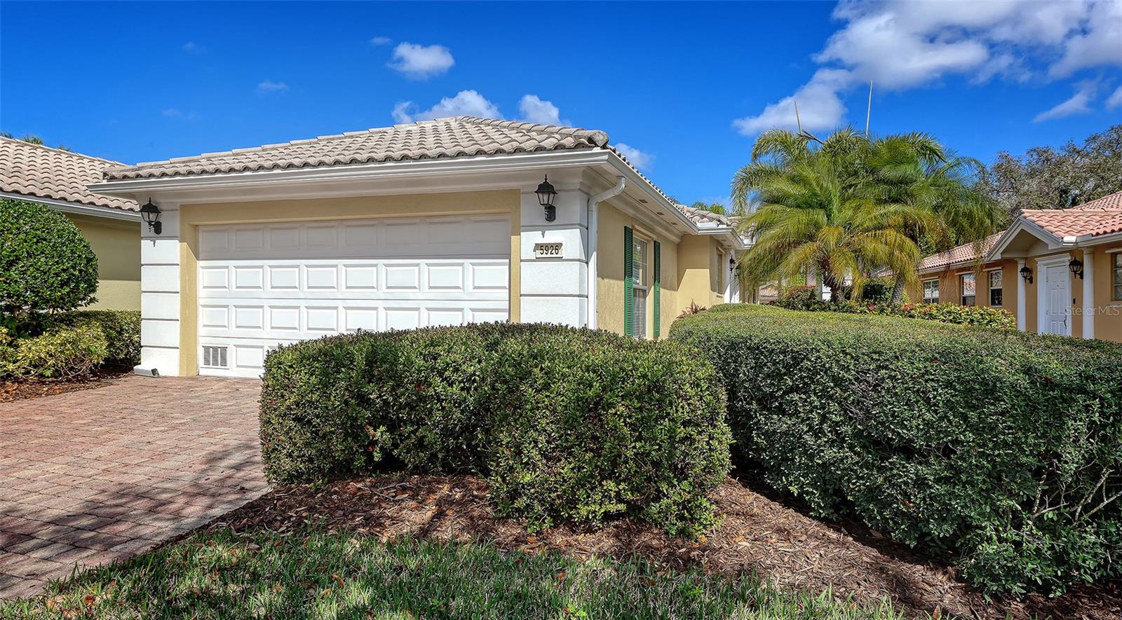 Best priced paired villa in The Isles of Palmer Ranch. 2 bedrooms plus 2 baths, new AC in 2019 & new hot water heater in 2021. Located close to the amenity center. Beautiful screened paver brick lanai with a paver brick extension outside of the screen. Tile throughout the living area with wood look vinyl in other rooms. This maintained villa is a bargain for Palmer Ranch make it yours!  Community features resort style amenities: heated pool, tennis, fitness center, clubhouse , bocce court & playground* Located on Popular  Palmer Ranch near world famous Siesta Key Beach,  shopping, golf, restaurants, Legacy Bike Trail, YMCA & easy access to I-75