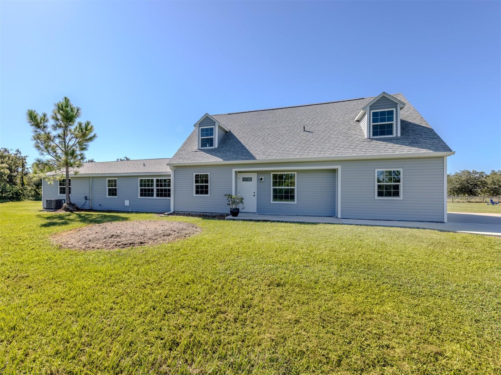 Virtually Staged. Highly desirable and rarely available. Be the first to enjoy this FULLY REMODELED and updated high and dry five-acre, four-bedroom, four-full-bath home. Rainbow Ranches is the perfect neighborhood if you are looking to enjoy daily visits from the resident wildlife. Enjoy a quiet cup of coffee while you watch deer, wild turkey, crested caracara, numerous hawk species and endless others as you stroll through or hang out in your own piece of heaven. Invite all your friends and enjoy a huge fire pit as you gaze up at the endless star-filled night sky, free from the city lights. The property also features a full 50-amp RV hookup with its own separate septic. A large concrete pad is in place, easily expanding this area into your dream RV location, workshop/garage, additional house/apartment or barn. The opportunities are endless. Recent updates include new PGT hurricane windows and sliders, all new interior and exterior doors, new AC units (2021/2024), a new roof, new vinyl siding, an updated kitchen, new flooring, updated baths, a full-house replumb, full electric upgrade, dual primary bedrooms, both with beautiful walk-in showers and frameless glass, new gutters facia and soffit, new interior paint, brand new well pump and the list goes on. This highly sought-after location in a friendly and quiet neighborhood has much to be desired. Bring your horses, cows, donkeys, bee farms or whatever your heart desires while still being close to all that Sarasota and Lakewood Ranch have to offer. Schedule your private showing today. You will be glad you did! This home does qualify for USDA financing!