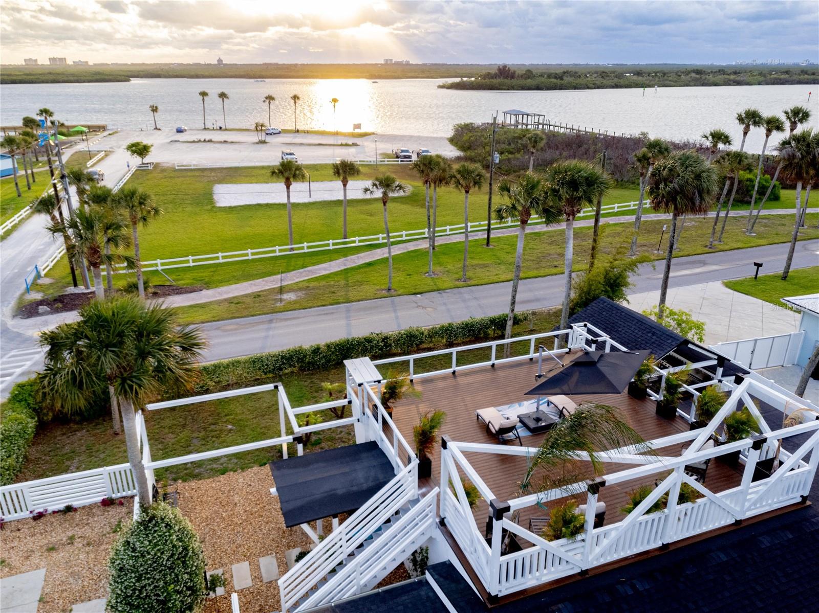 Seller offering up to $15,000 toward an approved mortgage-rate buydown, buyer closing costs or prepaid expenses with an acceptable offer. Buyers should consult their lender regarding available options.      

Intracoastal views from nearly every room, 2,286 SF of living space, 1,500+ SF of outdoor entertaining and lounge space, and a rooftop sunrise deck on a 10,584 SF corner lot. This 3-bedroom, 3-bath South Riverside coastal retreat sits directly across from Menard-May Park, the public boat ramp, fishing dock, and Intracoastal Waterway — offering water views, boating access, covered lounge areas, rooftop entertaining, and rare indoor-outdoor coastal living without direct waterfront maintenance.

Designed around light, views, and comfort, the home features spacious open living areas, a large kitchen, walk-in pantry, dedicated laundry room, enlarged bedrooms, redesigned bathrooms, guest-suite flexibility, and a converted garage living area.

Far beyond a cosmetic remodel, the home was stripped down to the studs and fully reimagined. Interior walls, plaster, drywall, insulation, electrical, plumbing, HVAC, doors, windows, and finishes were removed or reworked to create a fresh modern coastal layout built for the way people actually live.

This is a rare South Riverside opportunity combining Intracoastal views, rooftop entertaining, boating access, a spacious corner lot, and a builder-reimagined coastal home across from one of Edgewater’s best waterfront parks.