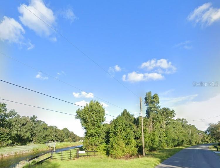 5913 Edgerton Avenue is a Unique, Beautiful and Private 1.91 Acre Oversized Homesite ~  This Property Boasts Great Road Frontage on  Edgerton Avenue, One of the Most Sought After Streets in all Of Wedgefield plus a Canal Along the Entire Rear of the Property for Added Tranquility!! WD Complete, CIA Complete, Miitgation Paid, Culvert Installed, Address Issued! All the Hard Work is Done, Start to Build Your Dream House Now!! Amazing 1.91 Acre Lot! Ready for your Dream Home to be Developed in Complete Privacy and Tranquility on Edgerton Avenue!! So Much Land you Can Build Your House Hidden Away in Your own Private Woods with a Pool, Guest House and Detached Garage! Ready to Embrace the Wedgefield lifestyle? Your chance is here on Edgerton Avenue with a Wonderful 1.91 Acre Improved Homesite. Edgerton Avenue is Lined with Gorgeous, Large Custom Homes!  The Property has 403 Ft of Frontage and 586 Ft of Canal Frontage. Wedgefield is Golf and Equestrian Community like No Other! A true Hidden Gem in East Orlando also known as Cape Orlando Estates. Large Playground in the Community Park, Multiple Ball Courts, Including Pickleball! Outdoor Exercise Equipment, Dog Park and Many Community Events to Enjoy! This Incredible Location of Wedgefield also is Home to the Hal Scott Regional Preserve and Park a 9,515-acre nature preserve. Hal Scott Preserves boasts miles of unspoiled sanctuary trails for hiking along the scenic shoreline of the Econlockhatchee River, with plenty of wildlife to view!! Trails are available for hiking, horseback riding and bicycling, and fishing is permitted. In Wedgefield the Proximity to 528 Allows for seamless commute to Lake Nona, Medical City or Downtown Orlando via 417, 408 or I-4 and The International Airport. The Shores of Port Canaveral and the Gorgeous Beaches are just minutes away. If you are looking to create your Dream Home near World-Class Amenities or seeking a smart Investment Opportunity Come see this Stunning 1.91 Acre Homesite on Edgerton Avenue Today!
