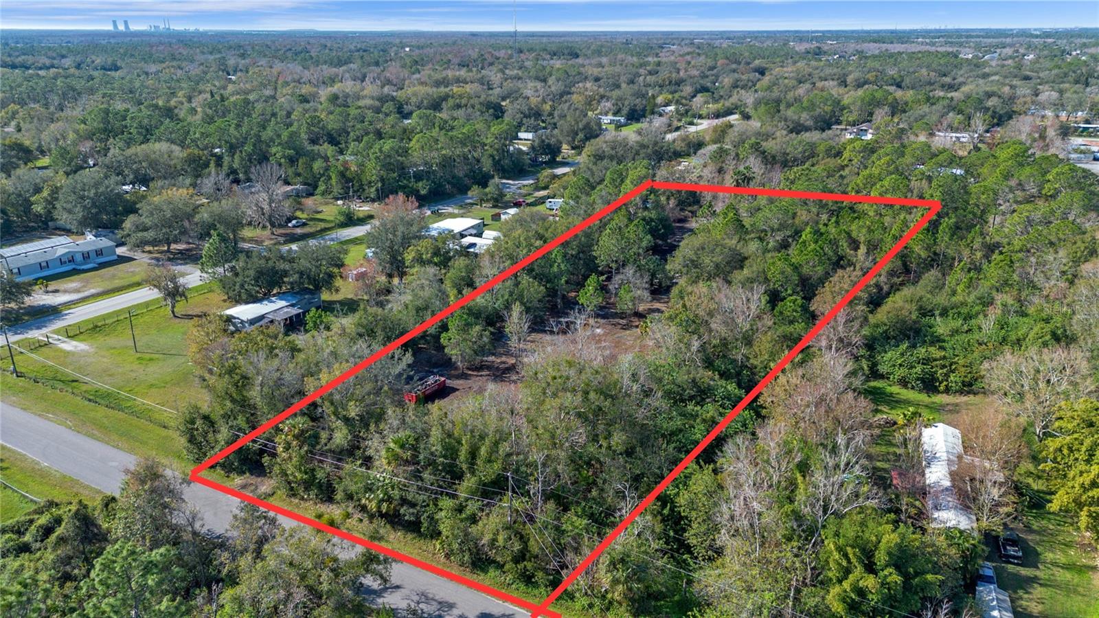 Beautiful high & dry 2.5 acre vacant land in Bitho area of Orlando! Lot is partially cleared and ready for your dream home or manufactured home. No HOA! Seller is in process of finalizing a lot split to provide 2x 1.25 acre parcels, if buyer is interested. Minimal wetlands on site (under 5% of total area), see attached survey and wetland report. Dimensions are 167' x 650'. Sign on-site for showing. Electricity available at the street, no water or septic currently.