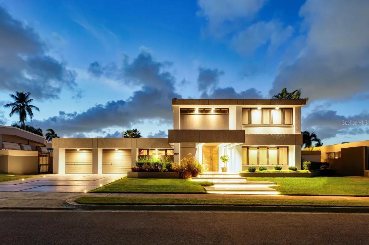 Located within the exclusive gated community of Urb. Santa María in San Juan, this elegant residence at 1920 Calle Petunia offers a refined balance of space, privacy, and everyday comfort. The home features 4 bedrooms, including two en suite, as well as a thoughtfully designed Jack and Jill bathroom, plus 2 half baths. With 4,379 square feet of interior living space set on an expansive 1,125.96 square meter lot, with an expansive backyard offering exceptional outdoor space for entertaining and relaxation.
 
Thoughtfully designed, the interior layout includes defined living, dining, and family areas, complemented by black slate flooring throughout and a well-designed kitchen that balances functionality with everyday comfort. The home features an open layout with all main living areas offering direct access to the patio. The primary suite is enhanced by a walk-in closet, while the outdoor areas elevate the lifestyle experience with a private pool, outdoor shower, and a whirlpool tub set within a lush, private setting. An equipped outdoor kitchen creates the perfect space for entertaining, complemented by expansive green areas ideal for pets and children.
 
Additional features include a spacious two-car garage with additional carport parking, solid concrete construction, a 17kW generator, and a 500-gallon cistern, along with fiber optic availability and controlled access with security. 
Santa María offers a variety of recreational amenities including tennis and pickleball courts, soccer and basketball facilities, a playground, and softball areas. The monthly HOA is $238. Anual CRIM is $3,653
 
A prime opportunity in one of San Juan’s most established communities, offering both tranquility and convenient access to top schools, shopping, and main access roads.